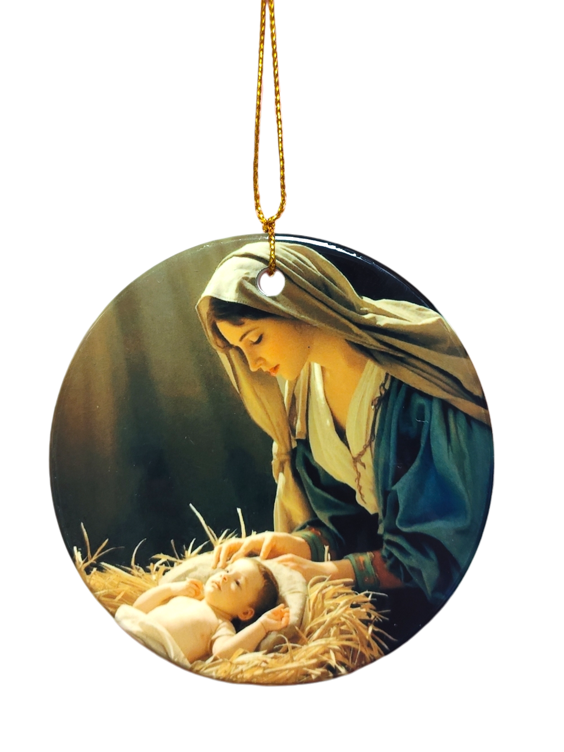 The Ornament: Nativity Scene Ceramic Ornament features a painting of a woman in a headscarf gazing at an infant on straw, with a gold hanging string—an elegant faith-inspired Christmas décor piece.