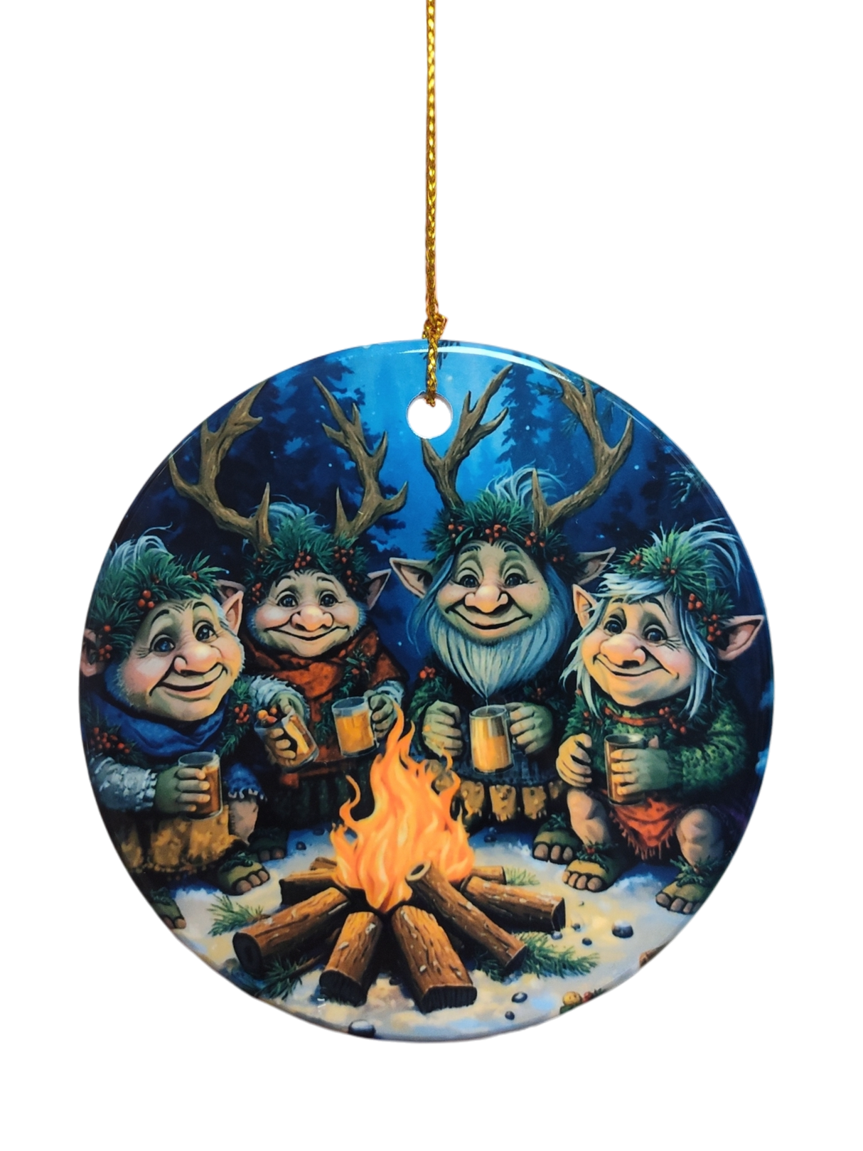 The Ornament: Gnomes Around a Fire Ceramic Ornament features four cheerful, antlered trolls with mugs by a campfire in a snowy forest—an ideal holiday tree decoration.