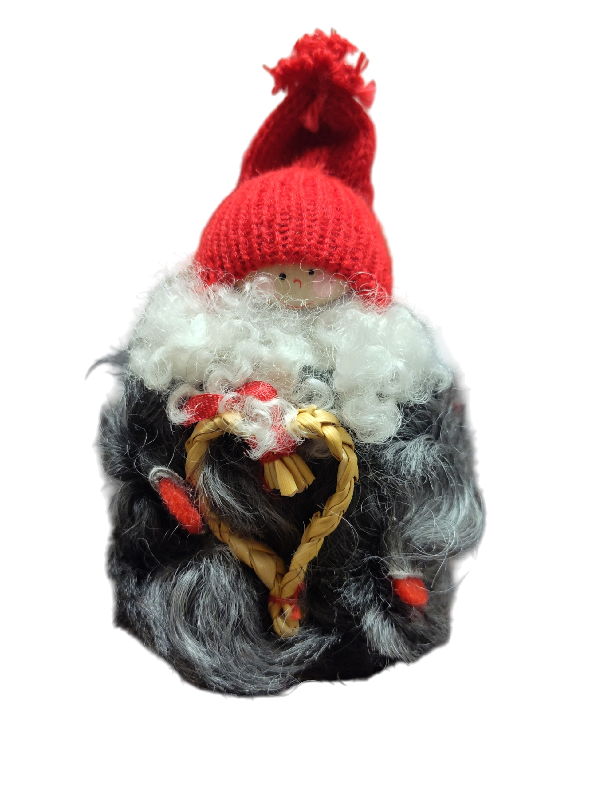 The “Figurine: Tomte with Heart” is a handcrafted piece inspired by Scandinavian folklore, featuring a red knit hat, white curly beard, gray fur coat, and holds a woven straw heart.