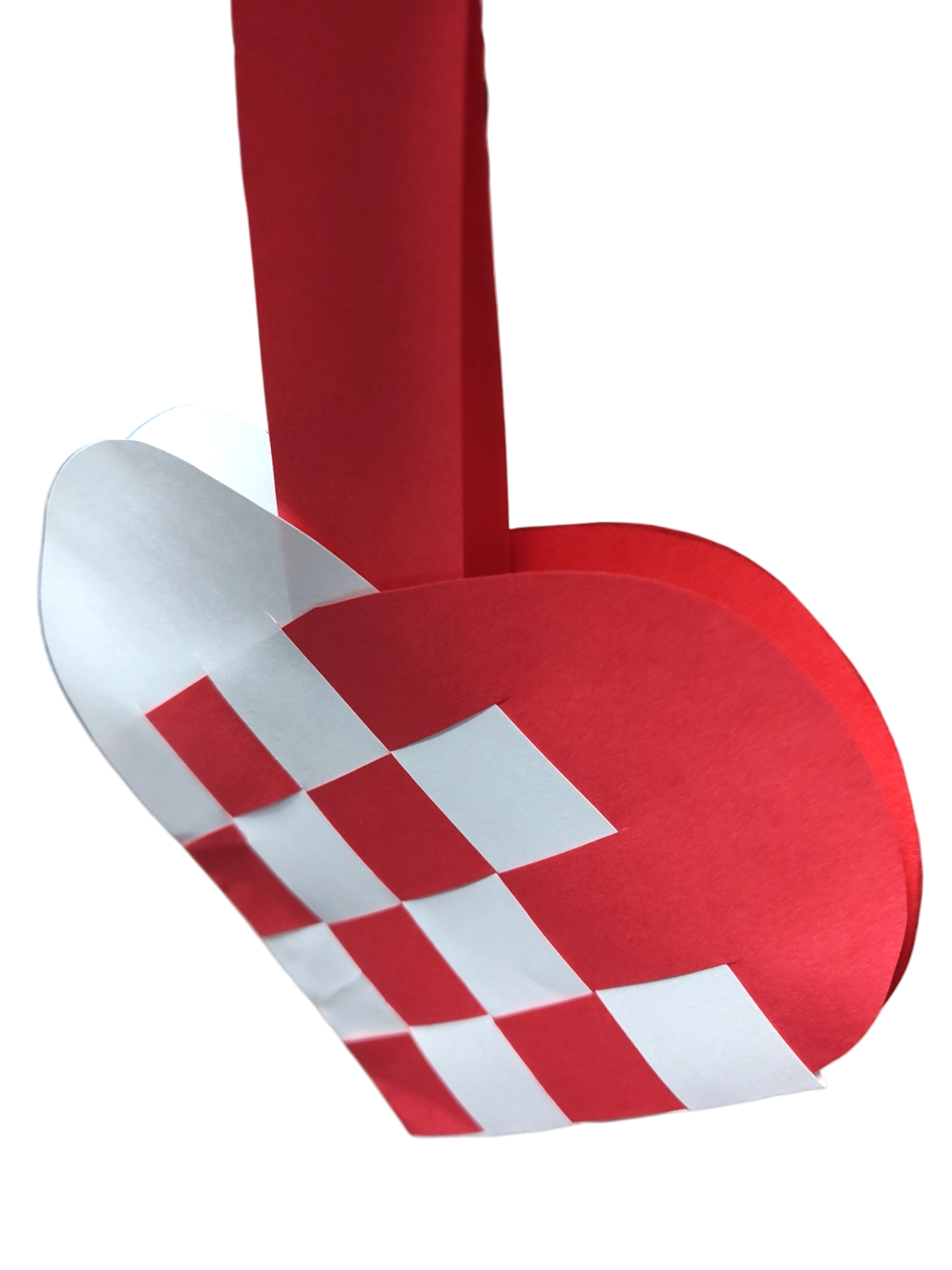 The Card: Danish Flag Traditional Scandinavian Handwoven Paper Basket Heart is a red and white woven paper basket with a handle, inspired by the Danish flag and used as a festive Scandinavian decoration.