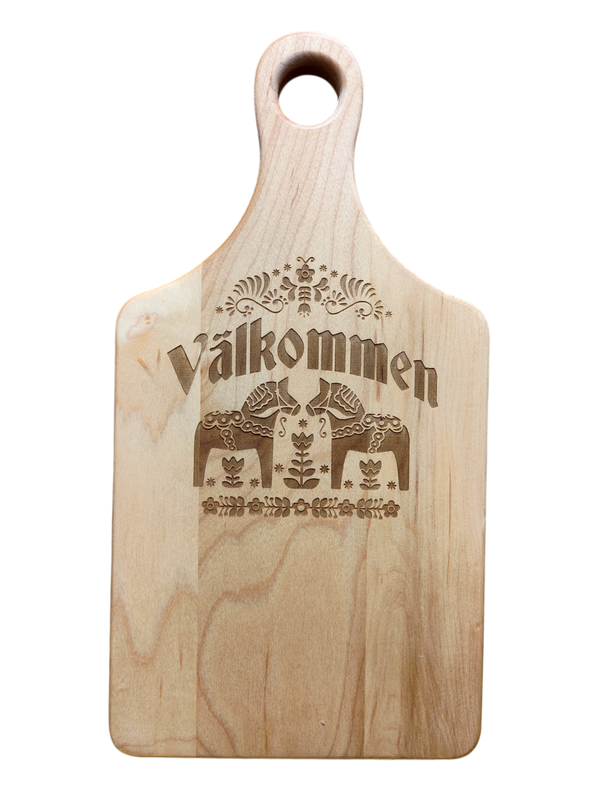 Maple wood cutting board (13.5" x 7") with handle, engraved Swedish folk art design, and “Valkommen” (Welcome in Swedish) at the center.