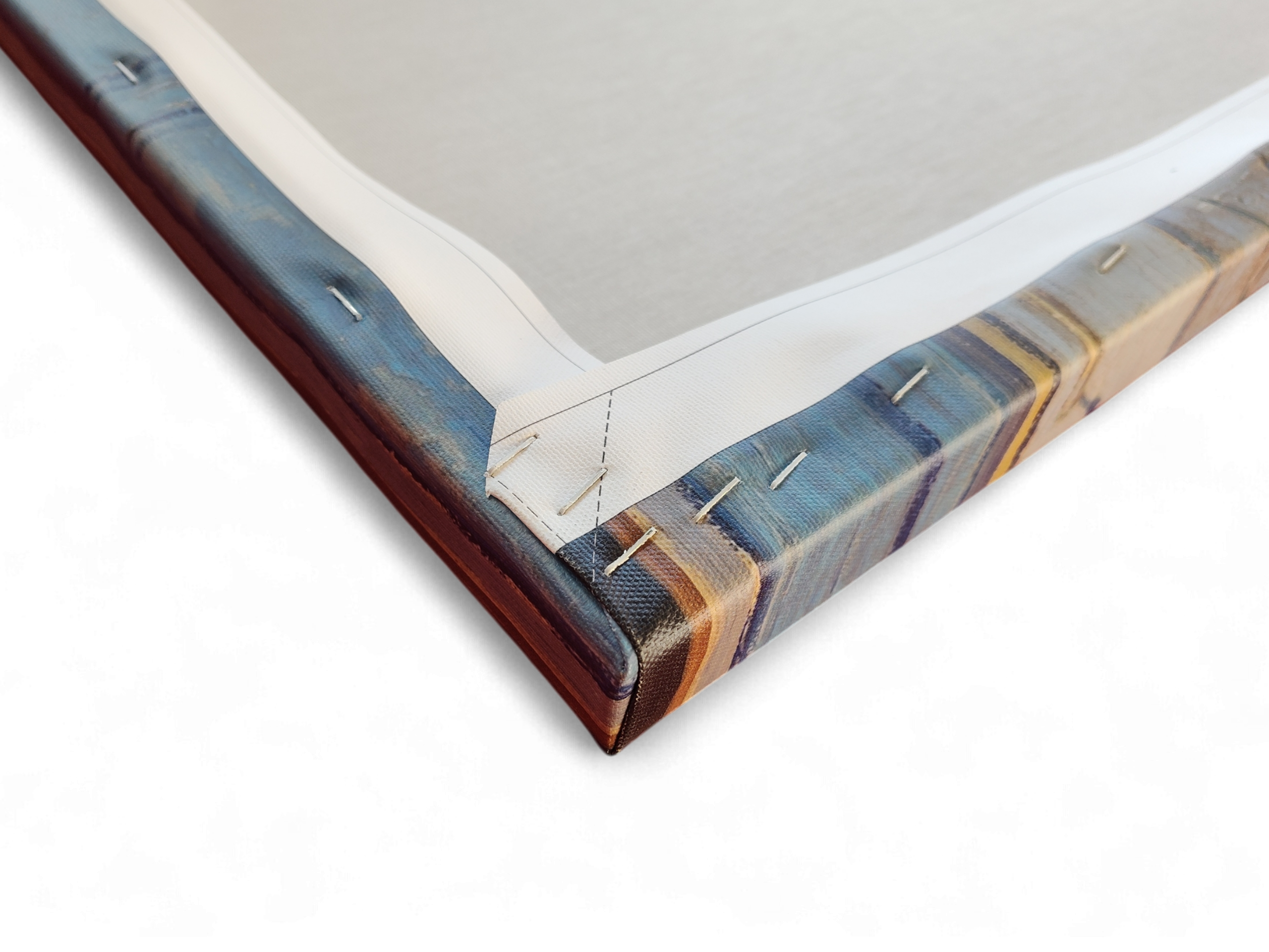 Close-up of the back corner of "Artwork: Bedroom in Arles Vincent Van Gogh 1853 - 1890 Print on Canvas," showing folded and stapled edges secured to a wooden frame.