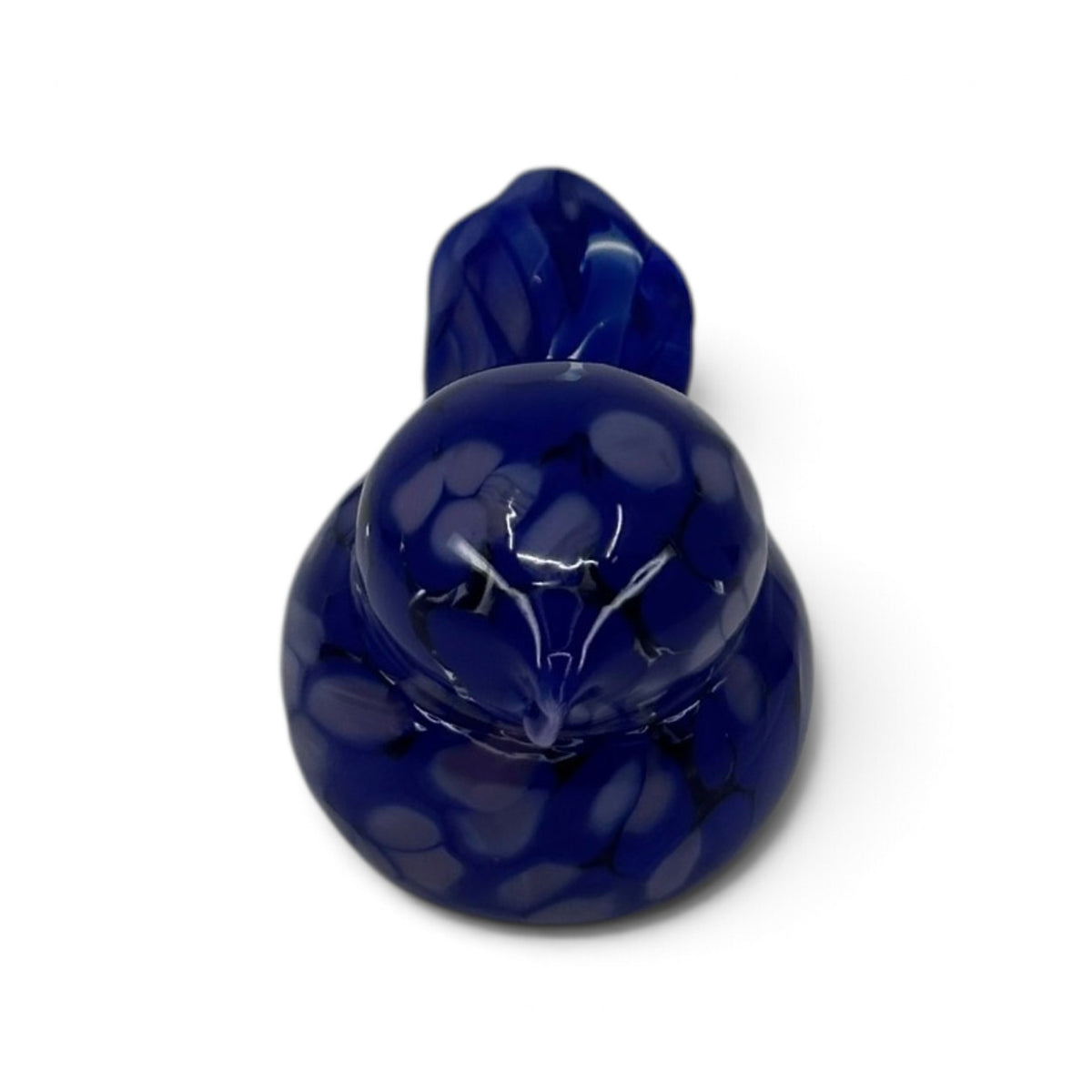 Hand blown glass bird figurine in deep blue with white speckles, shown from above on a white background.