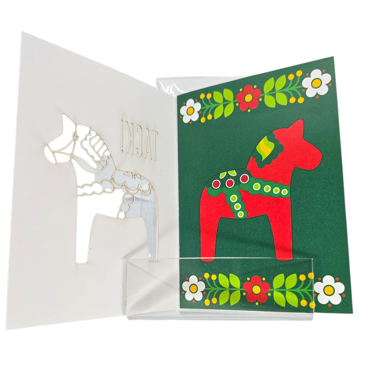 The "Tack! Swedish Thank You Card" features a red laser-cut Dala Horse on a green background with floral borders and a white paper horse cutout on the left, inspired by open Nordic folk art.