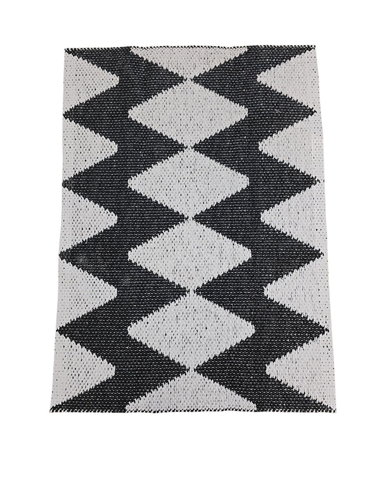 The Horredsmattan Zigge vinyl rug features a rectangular design with black and white geometric diamonds and gray stripes on one side; this stylish Swedish rug is durable and machine washable for easy care.