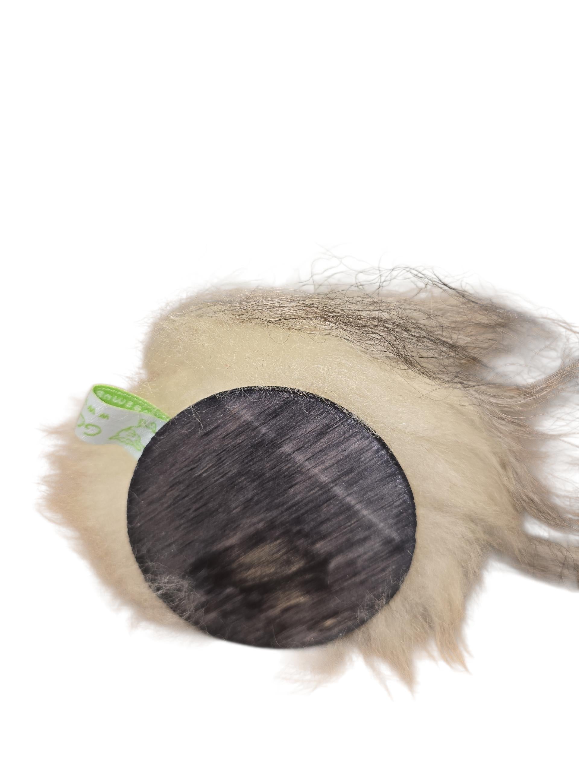 A round, furry gnome with a dark wood base and green tag, set against white—a handcrafted “Patch Tomte” by Gumselids of Sweden (7" to tip of hat) that’s perfect for sheep wool decor or as a Swedish Tomte-inspired accent.