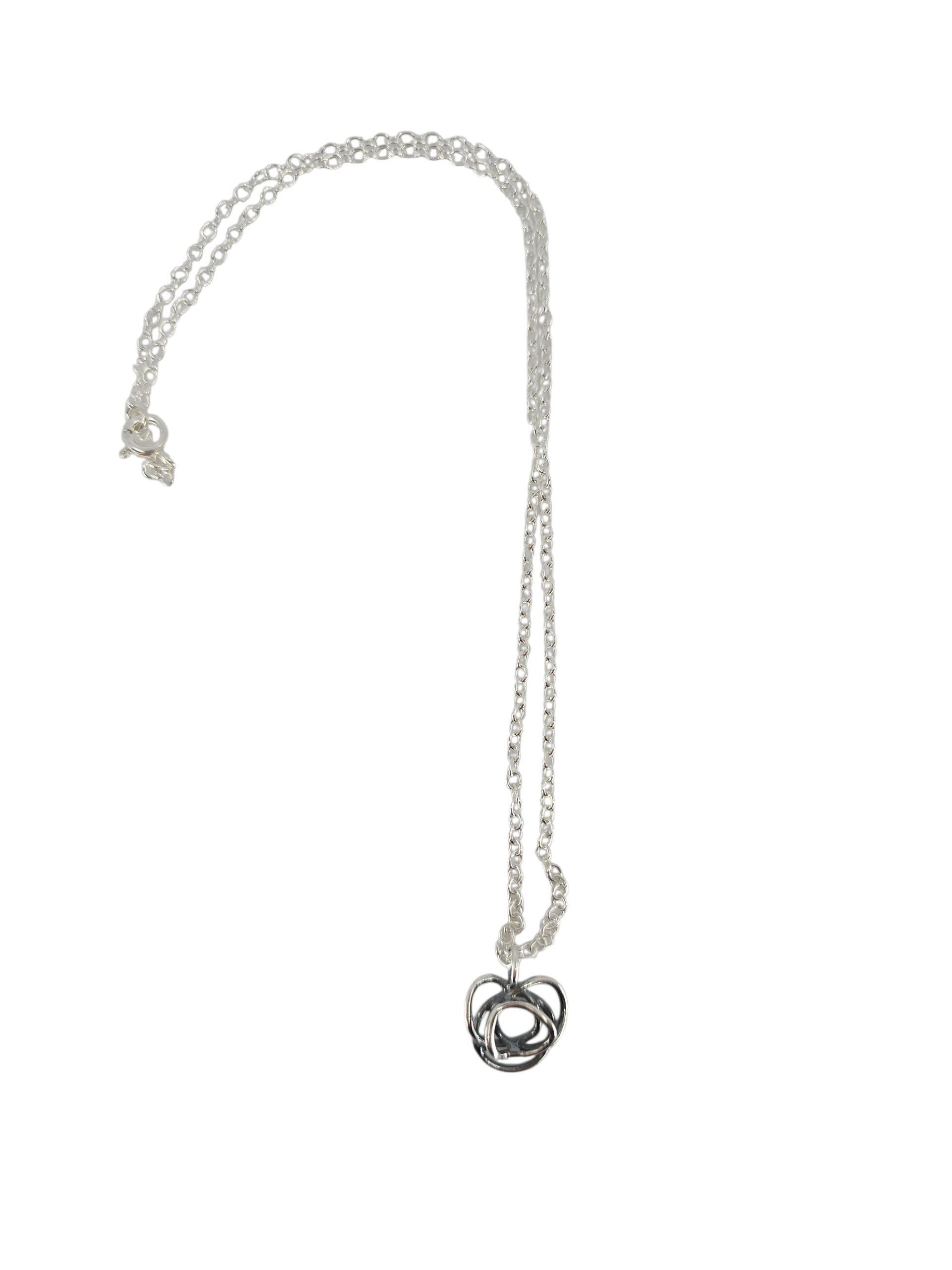 The Flor Alida Floral Necklace features a sterling silver 5/8" floral pendant on an 18" chain, inspired by Scandinavian jewelry and showcased against a plain white background.