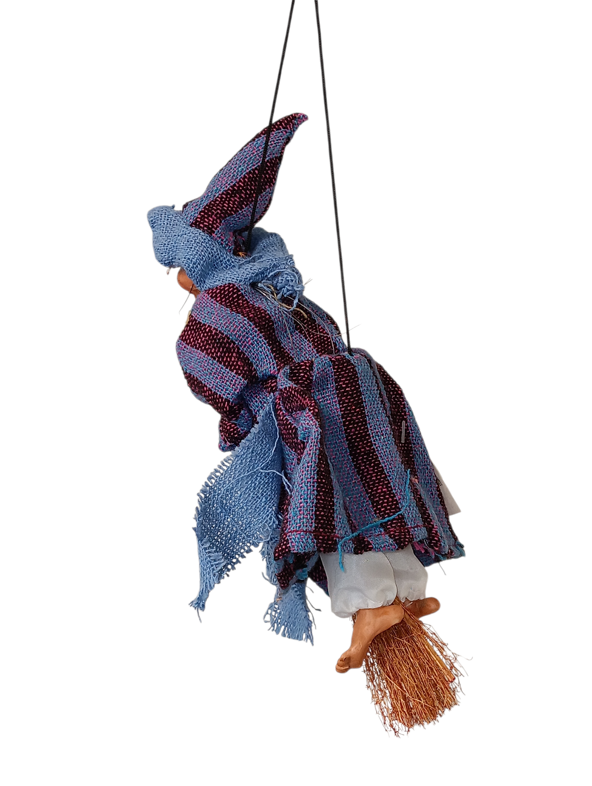 The Kitchen Witch: Philippa Blue Kitchen Witch Doll is a handmade German good luck charm, featuring a blue and purple striped outfit and hat, riding a broomstick and hanging from a black string—a whimsical decor piece for your home.