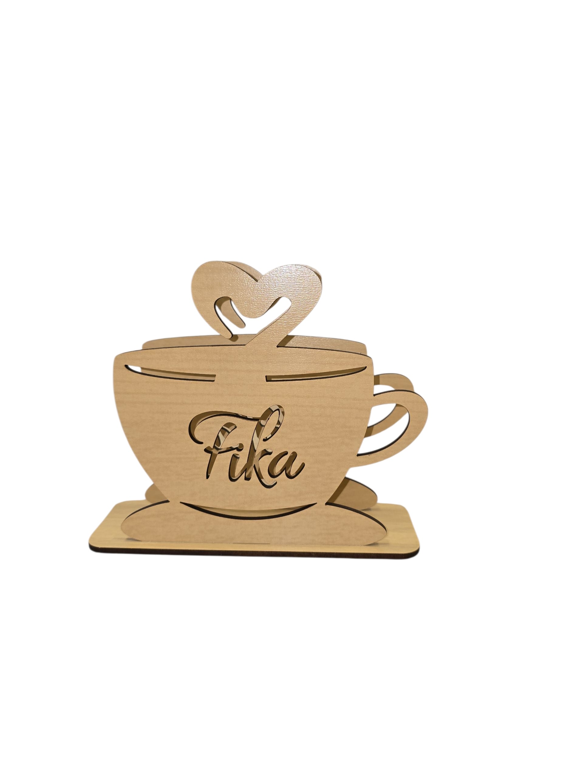 The Napkin Holder - FIKA Coffee Cup is a laser-cut birch napkin or letter holder (6" x 5" x 1.75") featuring a teacup shape with heart-shaped steam and "Fika" on the front—a delightful decor piece for any space.