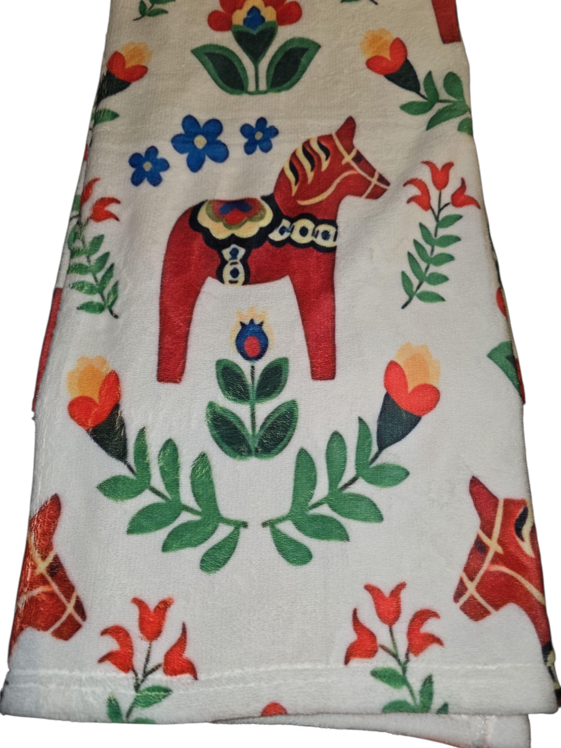 The Blanket: Dala Horse Children's Blanket 29" x 40" features colorful floral patterns and red Dala horses inspired by Scandinavian folk art, celebrating Swedish heritage with a cozy, charming design.