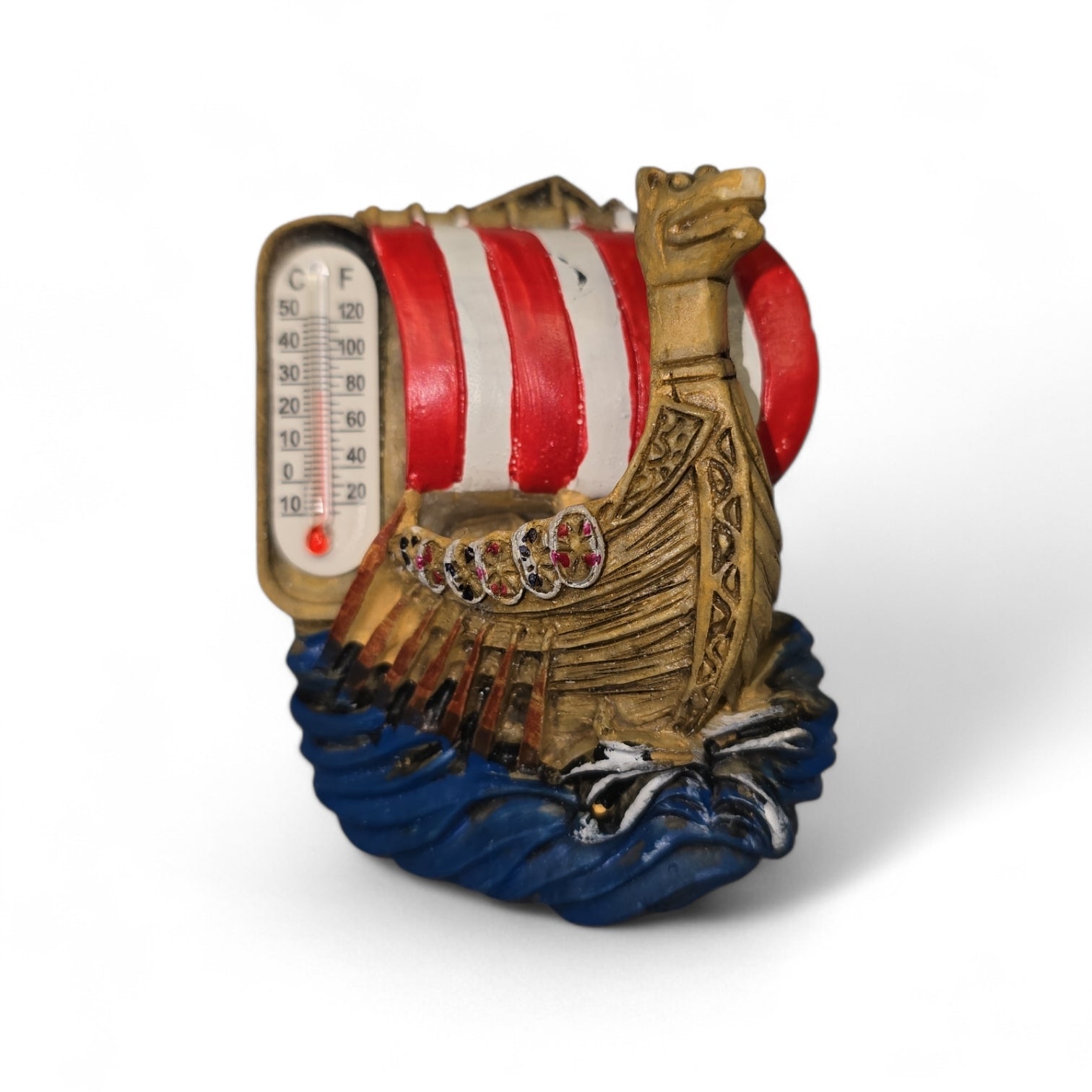 The Vikings Ship with Thermometer Refrigerator Magnet features a red and white striped sail, blue wave base, and left-side thermometer—perfect as a Scandinavian souvenir for your fridge.