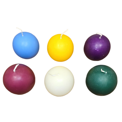 A 4-pack of Logum Kloster Lys 2.5" ball candles in assorted colors is arranged on a white background—ideal for bringing Scandinavian décor charm to any room.