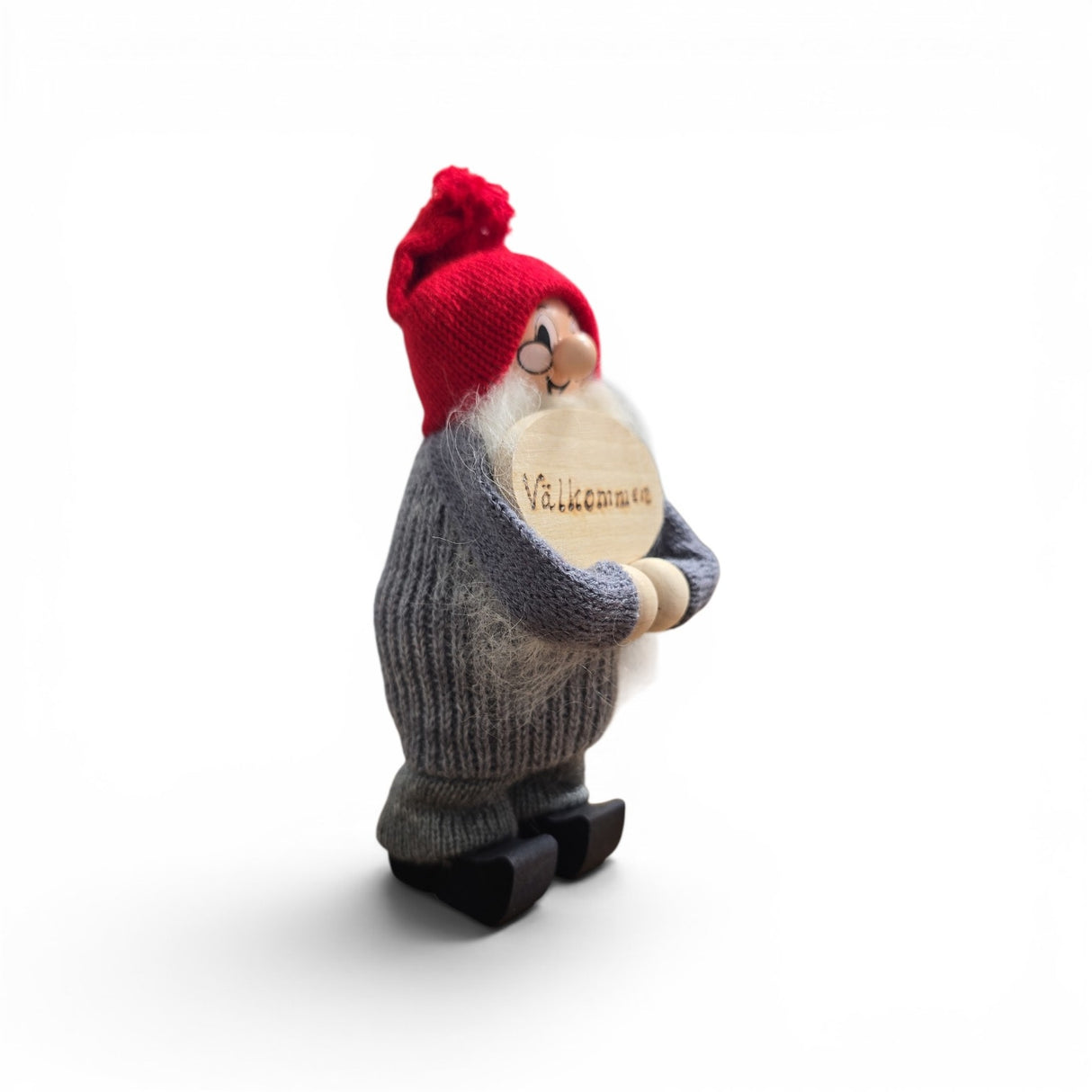 The Swallings Swedish Santa Figurine, handcrafted in Sweden, stands 6.5" tall with a red cap and "Valkommen" welcome sign—perfect Nordic holiday décor for your home.
