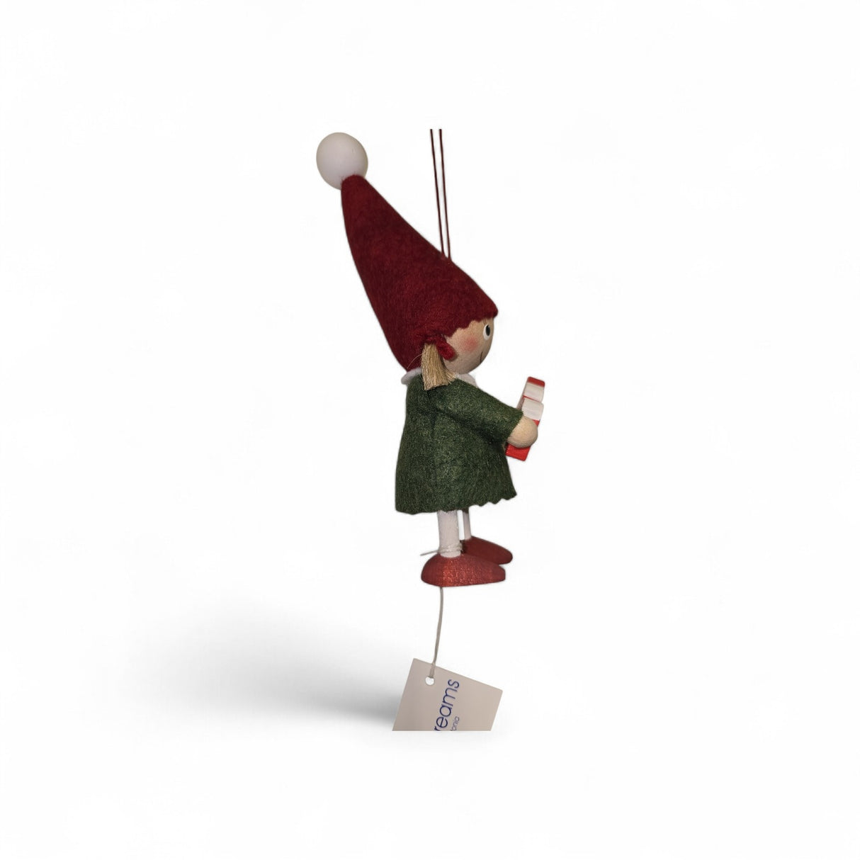 A small handcrafted Scandinavian Girl figurine holding a Dala Horse, featuring a red hat, green coat, and red shoes, suspended by a string with an attached tag.