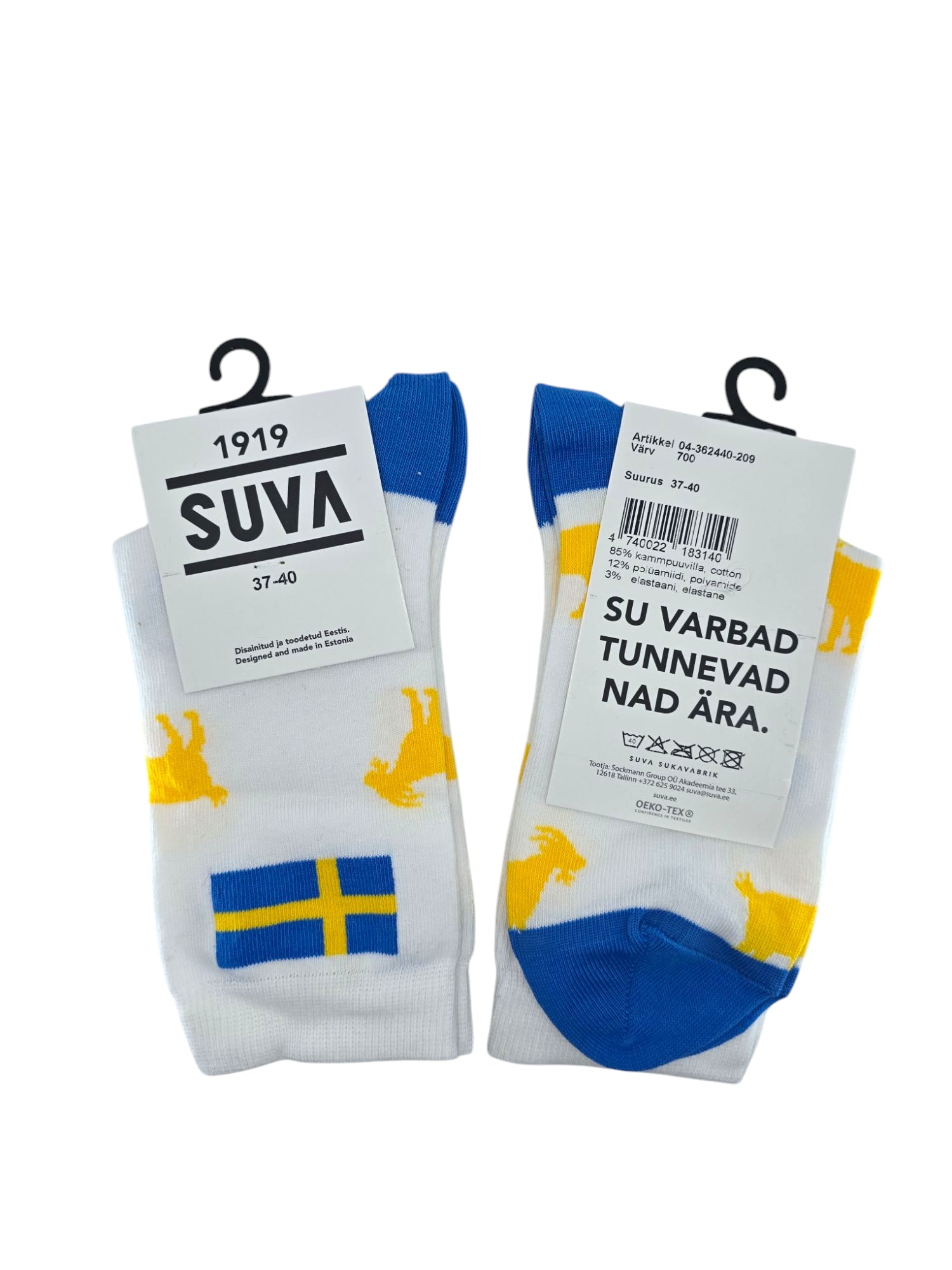 Two pairs of the Socks: Swedish Flag & Yellow Goat in white with blue and yellow accents, featuring a Swedish flag design and yellow moose silhouettes. Made in Estonia, the tags display sizing info and a message in another language. Suitable for womens sizes 6-10 (37-40).