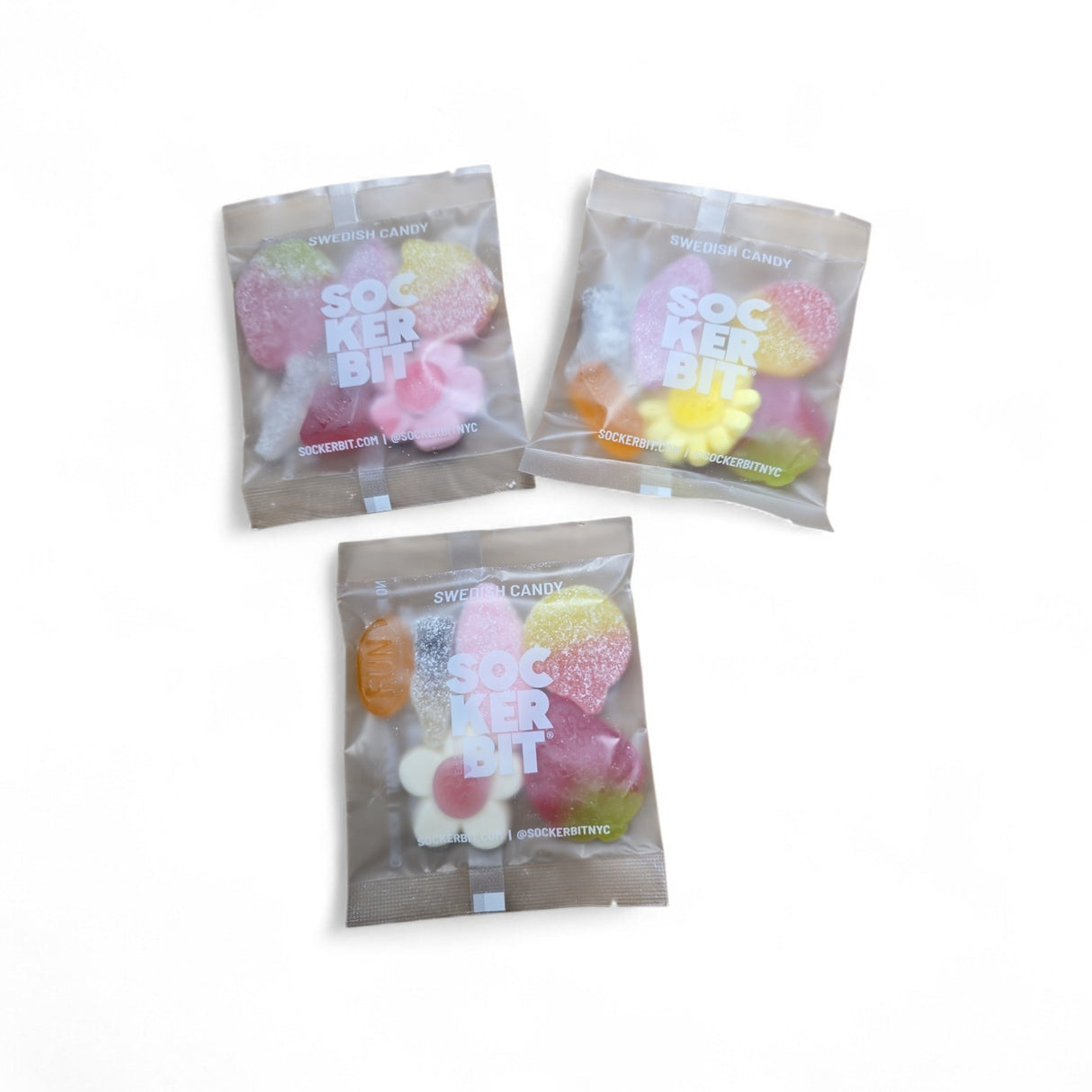 Three clear 1.6 oz Sockerbit Swedish Candy Single Serving Bags are shown on a white background, each filled with colorful GMO-free gummies in assorted shapes.