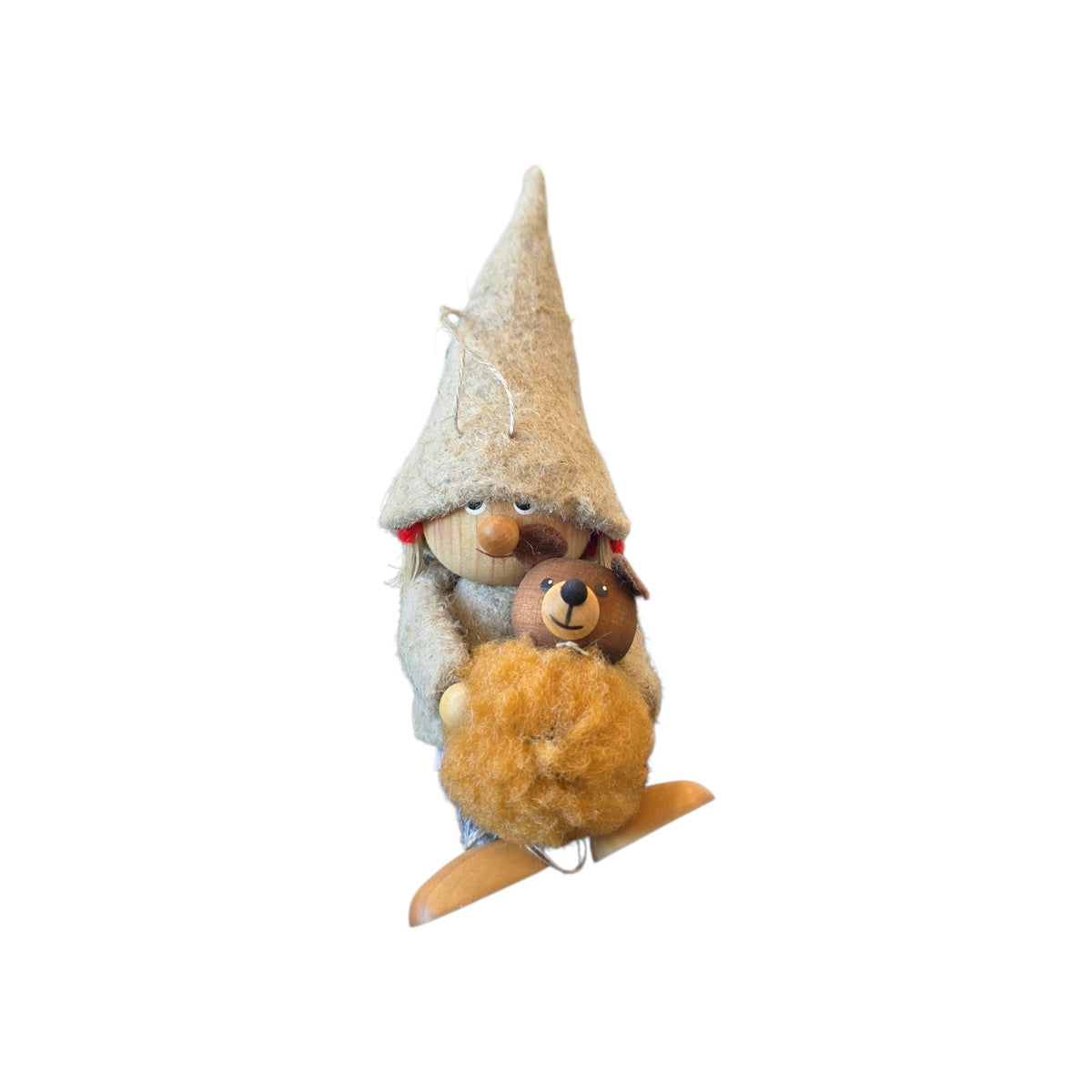 Scandinavian tomte girl felt gnome ornament wearing a tall pointed hat and holding a small, fuzzy brown bear.