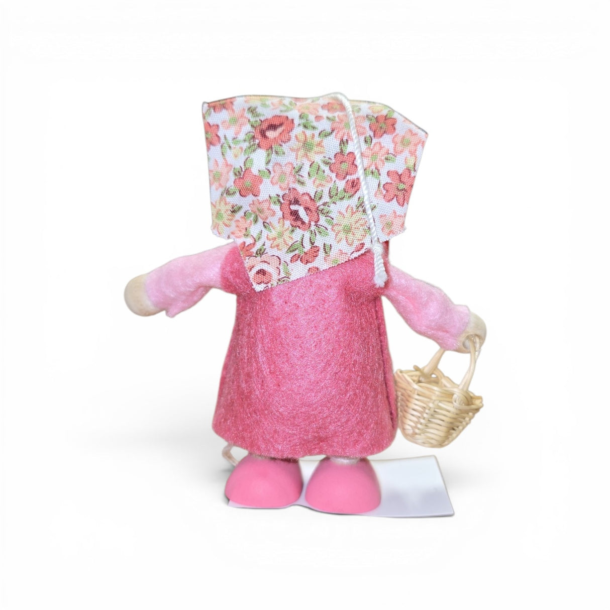 The Faire - Nordic Dreams Figurine: Scandinavian Tomte Girl in Pink (Gnome) holding a basket adds charming Nordic style and sweet Scandinavian tradition to any decor. Made in Scandinavia, pictured against a white background.