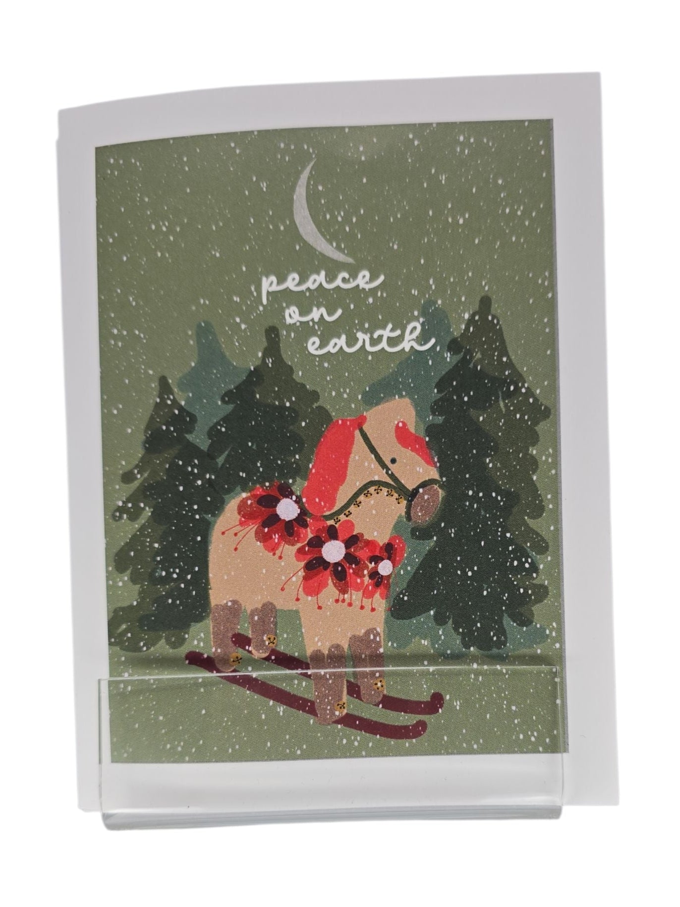 This card pack features Lisa Rydin Erickson’s Dala Horse on skis with “Peace on Earth”—a Scandinavian-inspired holiday design. Includes 8 blank cards and envelopes.
