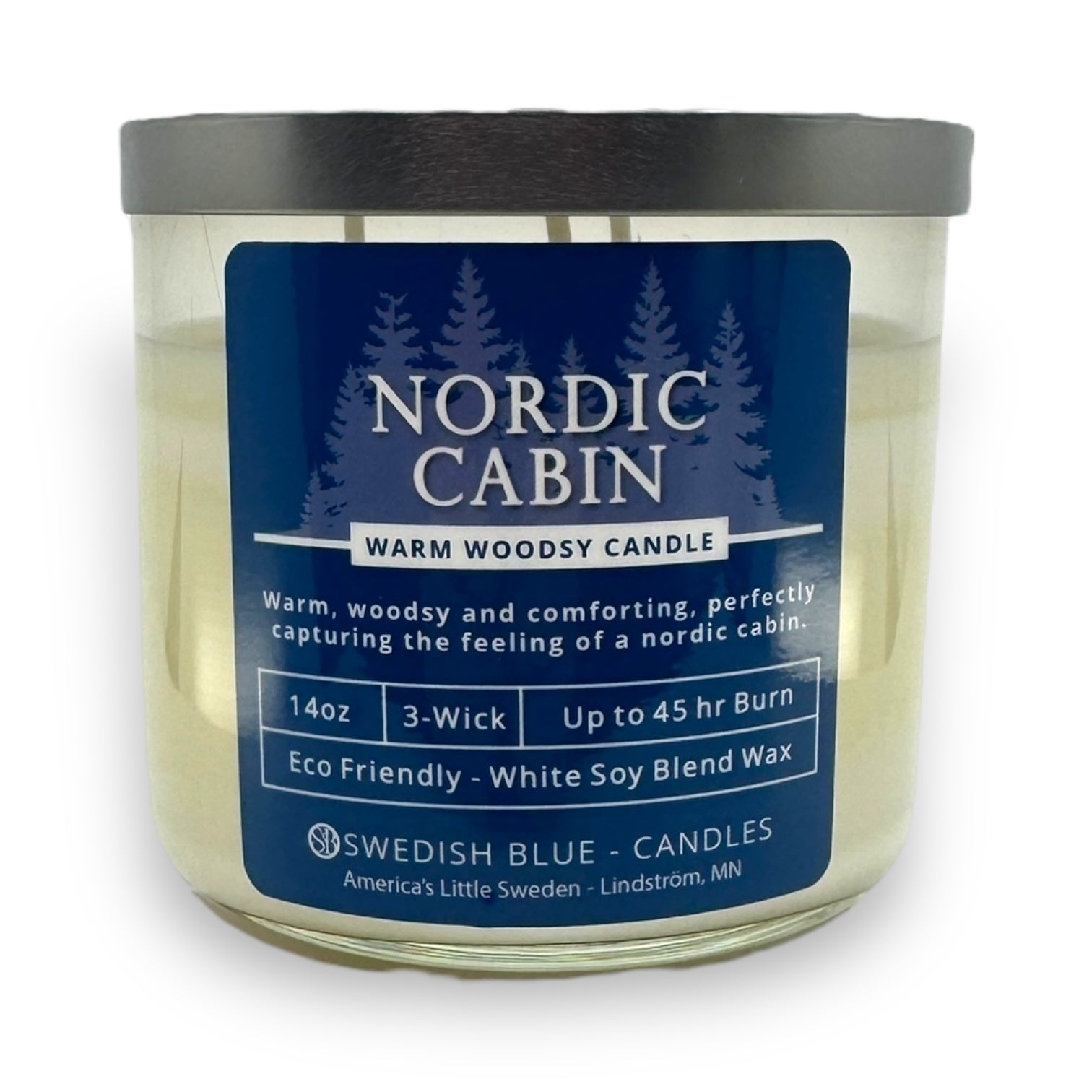 Candle: Nordic Cabin - Warm Woodsy Candle by Swedish Blue Candles comes in a 14oz blue-labeled jar, features an eco-friendly design, offers a cozy forest scent, and provides up to 45 hours of comforting burn time.