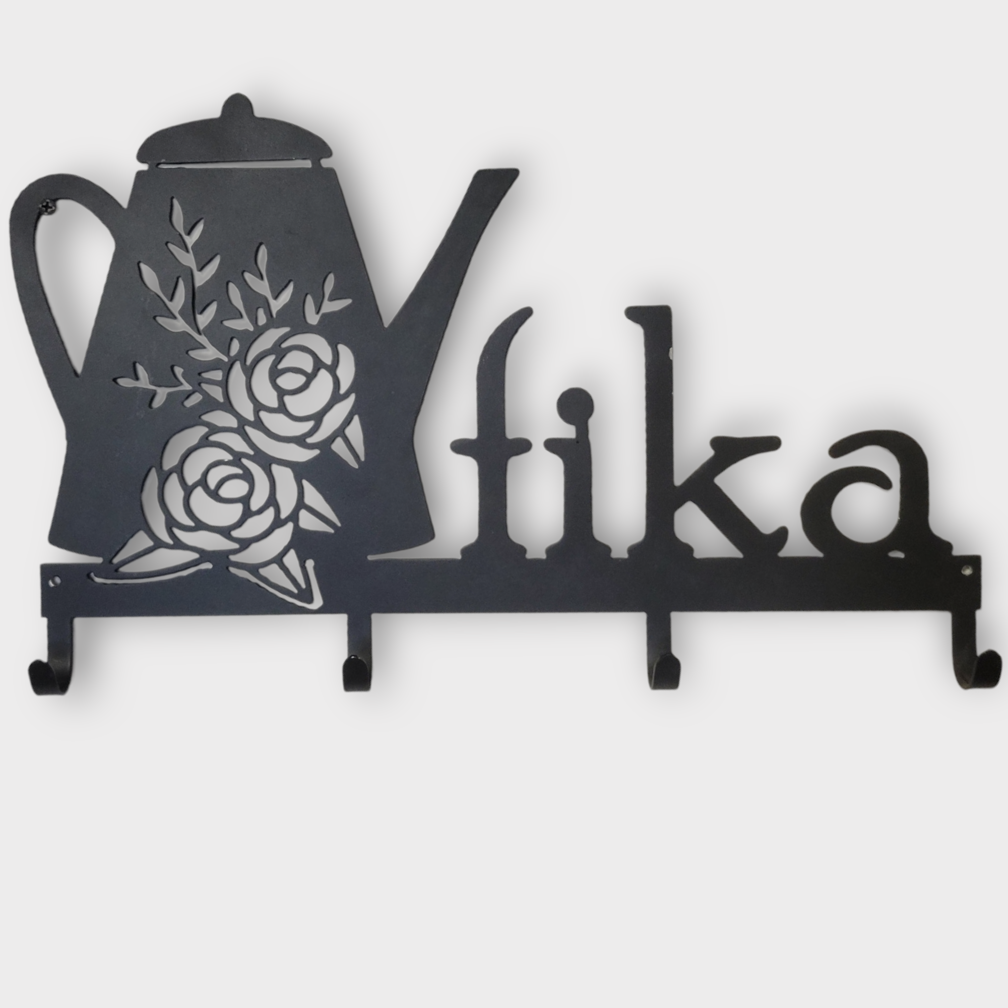 A black metal rack features a coffee pot with flowers and the word fika, offering 4 sturdy hooks for mugs or coats.