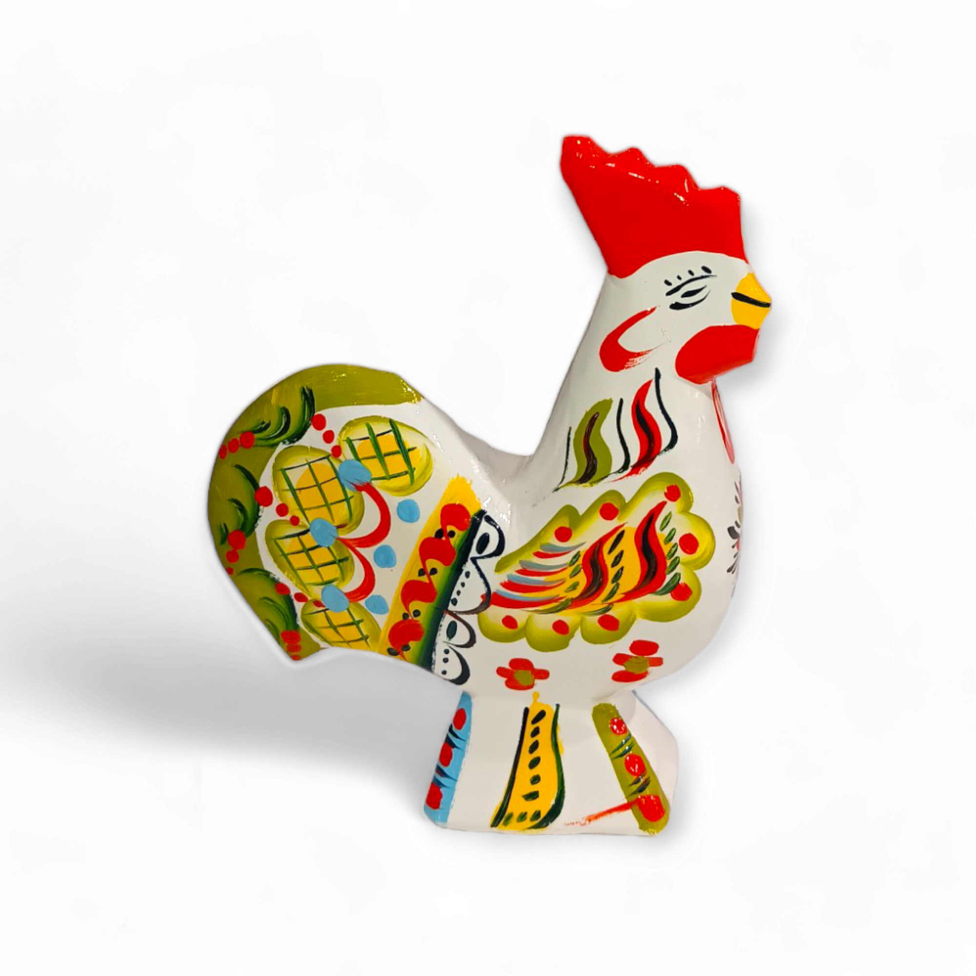 Introducing the Dala Rooster: White, a vibrant ceramic rooster adorned with decorative floral and geometric patterns. It features an array of colors, including red, green, yellow, and blue set against a white background. Inspired by traditional Swedish handcraft and Dala roosters, this piece embodies the charm of hand-carved and painted artistry.