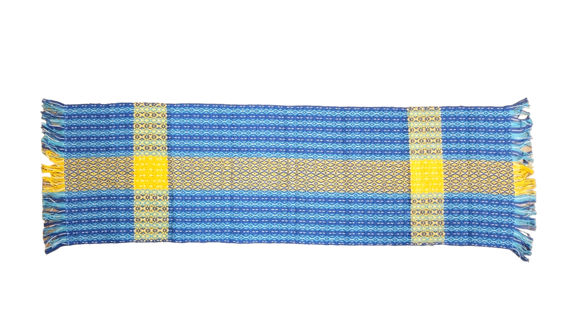 The Swedish Flag Runner is a handwoven rectangular table runner (46-49) made from 100% cotton, featuring blue and yellow horizontal stripes and fringe on both ends, inspired by the Swedish Flag.
