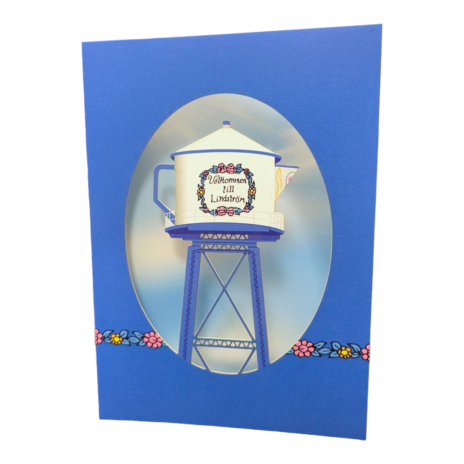 A Swedish card featuring the iconic Lindstrom Water Tower painted as a teapot, with floral accents and the greeting "Valkommen to Lindstrom"—a charming way to celebrate America's Little Sweden.