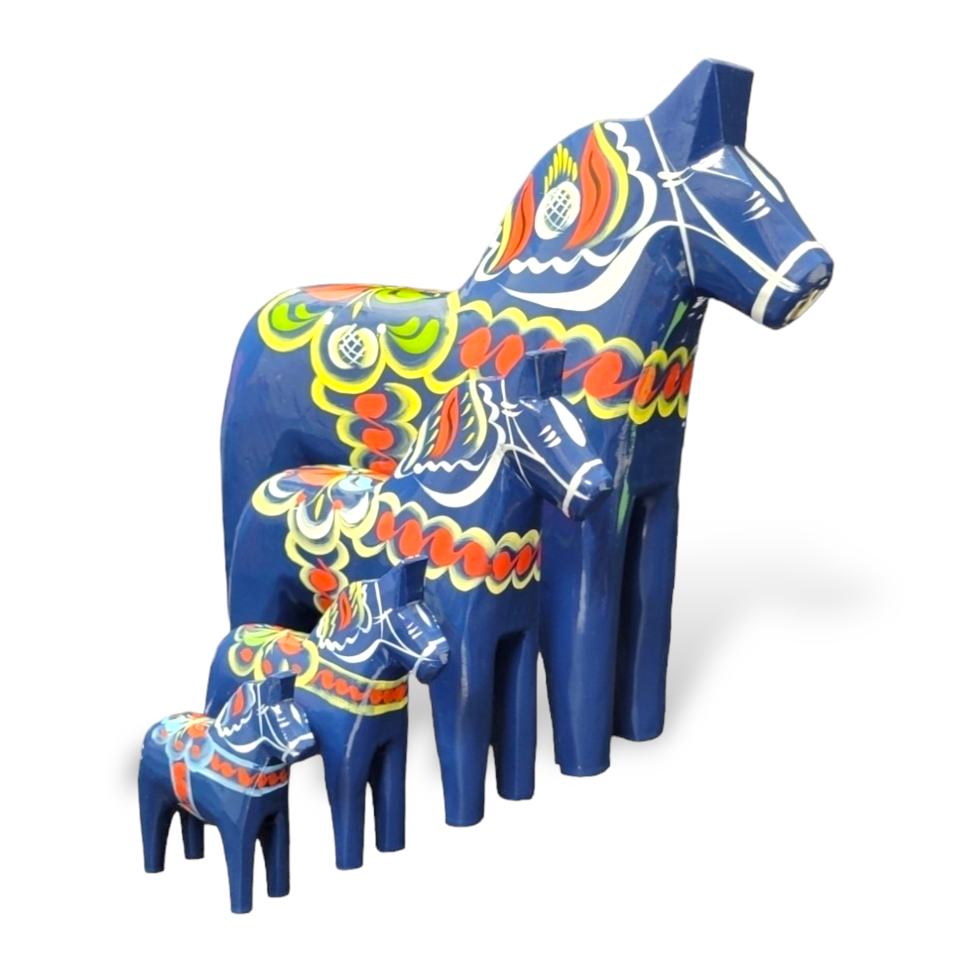 A set of four hand-carved Dala Horses in blue, featuring intricate multicolored kurbits patterns and arranged in descending size order.