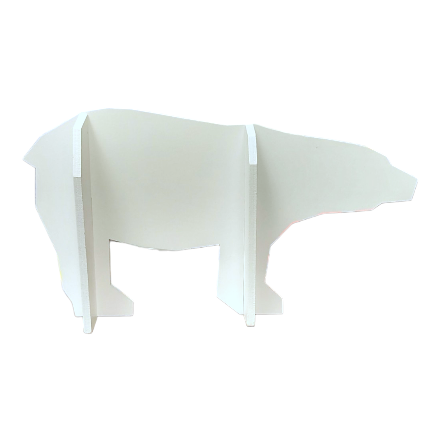 A white wall shelf in the shape of Figurine: Jagar the Polar Bear - The Polar Bear Wish Book provides three flat sections for support against a plain background.