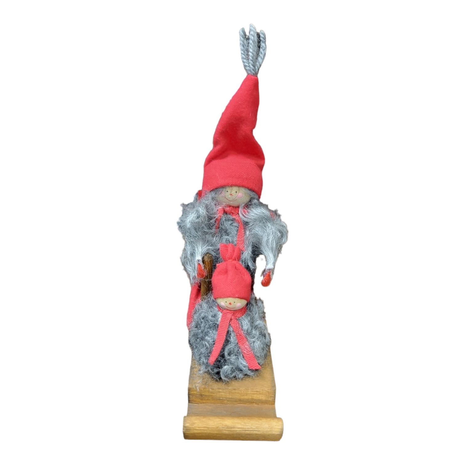 The "Santa Girl with Sled & Baby" is a meticulously handcrafted wooden figurine from Sweden, showcasing a bearded figure in a red hat and gray cloak that likely represents Santa. This delightful piece depicts the character holding a smaller figure and stands securely on its wooden base, making it an ideal Christmas decoration.