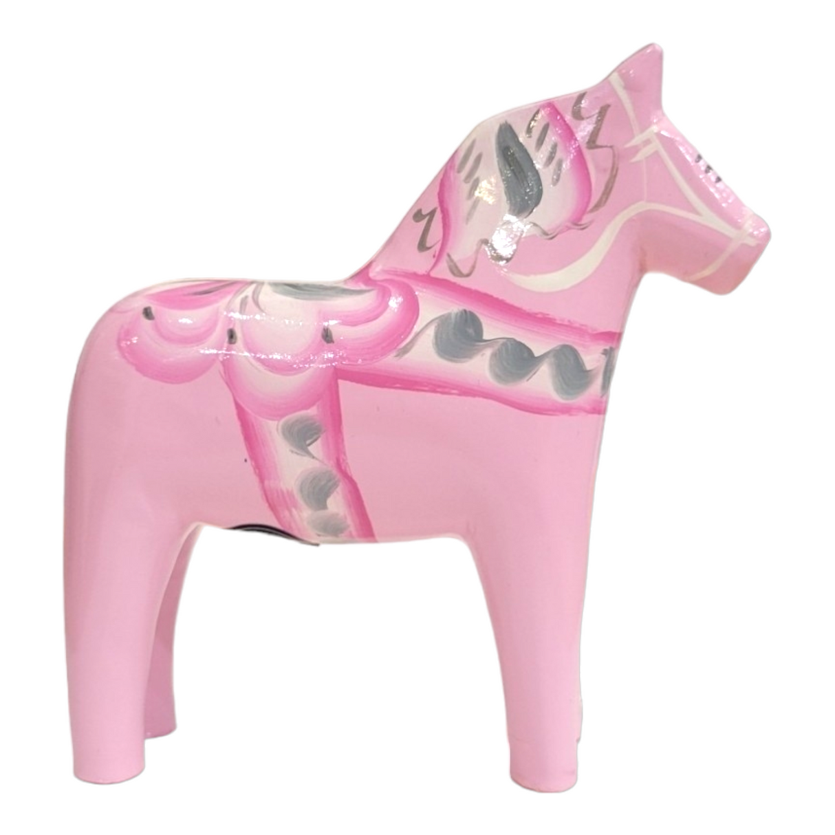 A Baby Pink or Baby Blue Dala Horse figurine, a classic Swedish handicraft, features decorative white and gray patterns. Hand-carved and painted, its displayed in profile against a clean white backdrop.