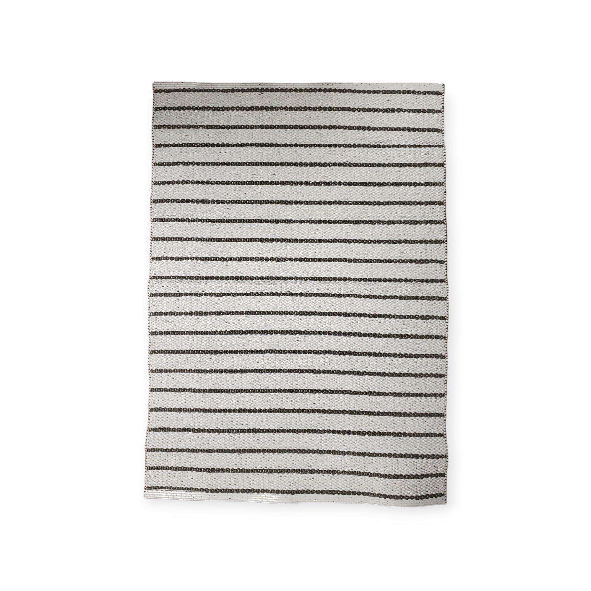 The Horredsmattan - Music - Dark Gray Vinyl Rug is a durable, rectangular woven cloth featuring alternating black and white horizontal stripes on a plain background.