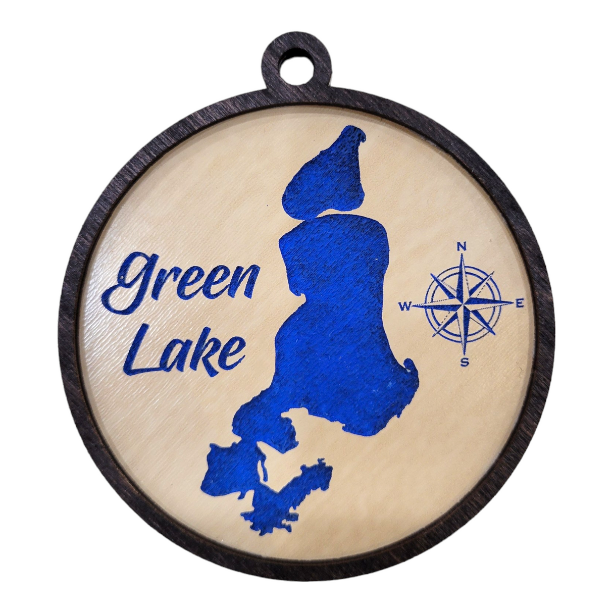 Round etched wooden ornament, 3 1/2 inches in size, with a blue silhouette of Green Lake and a compass rose design to the right. The text reads "Green Lake.