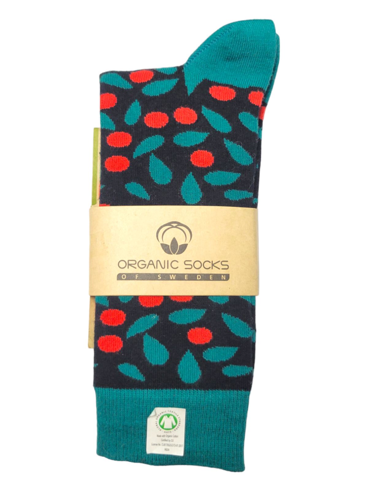 A pair of socks with a red and green leaf pattern, wrapped in a brown label that reads “ORGANIC SOCKS OF SWEDEN.”.