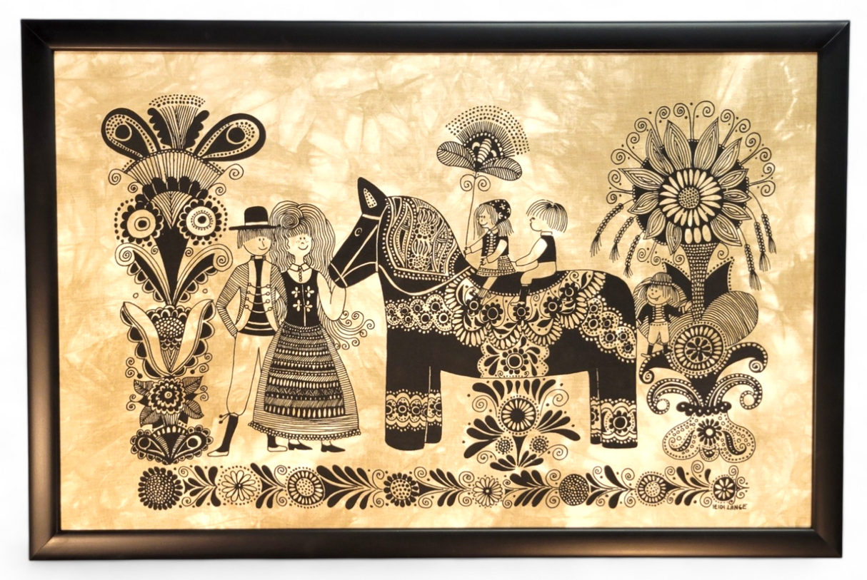 Artwork: "Dala Horse & Family" Framed (27.5"x19") by Swedish Artist Heidi Lange features a folk-style scene with two adults, two children on a Dala Horse, and black floral patterns on a beige background.
