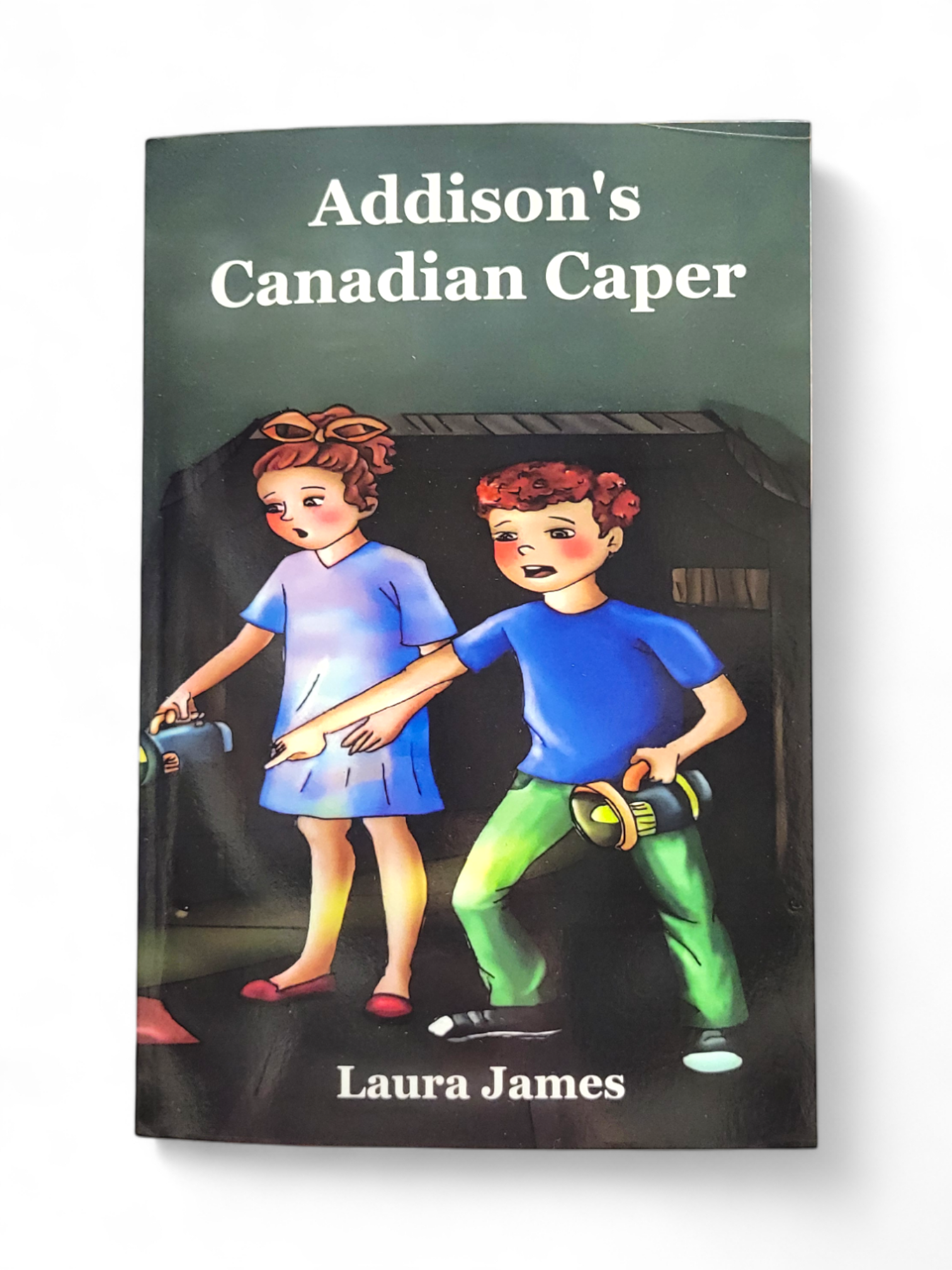 Cover of the book, "Addison's Canadian Caper," showcases two children holding flashlights in a dimly lit room, their sense of curiosity matching that of an adventurous Canadian challenger.