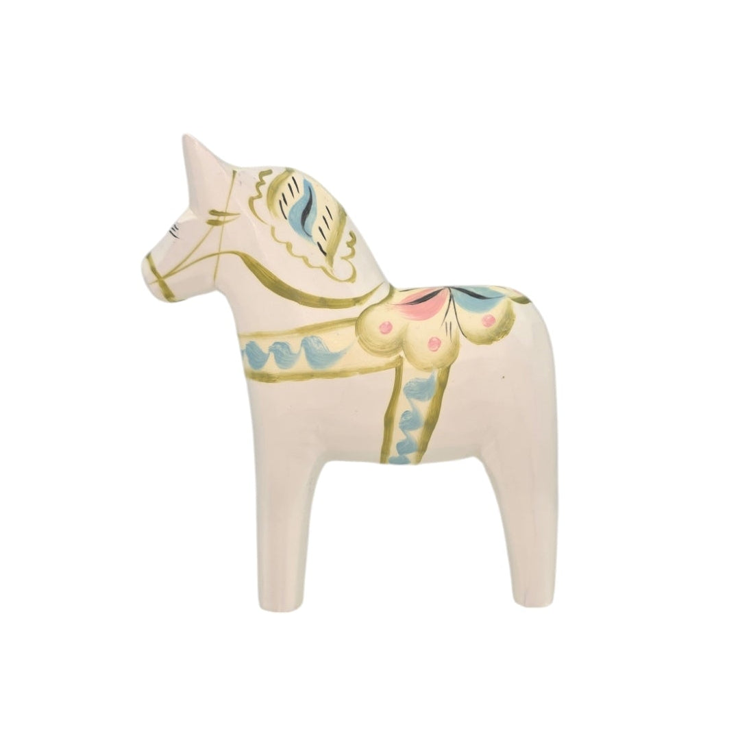 The Dala Horse: Pastel on White Swedish Dala Horse with Kurbits ceramic figurine showcases hand-painted green, pink, and blue floral designs.