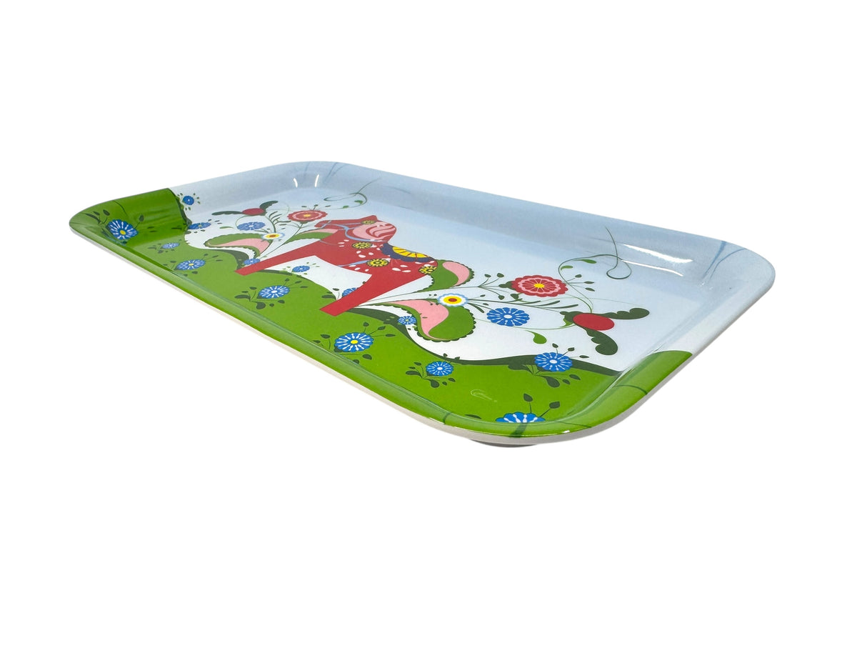 Rectangular melamine tray with rounded edges, a green border, blue flowers, and a stylized red and white Swedish Dala horse at center—infusing Scandinavian charm to this novelty Swedish Dala Horse tray.