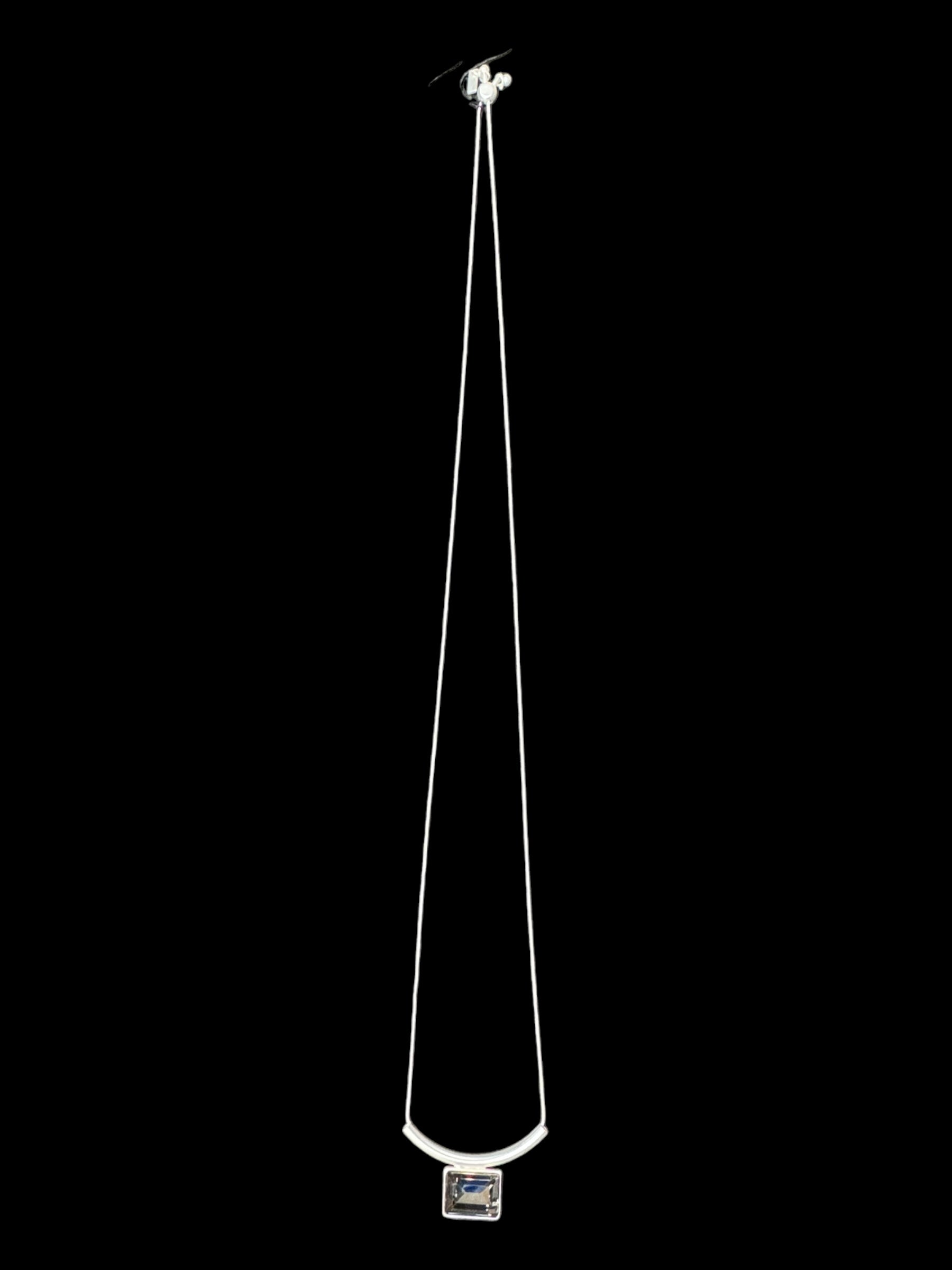 The Audrey Black Diamond Silver Plated Necklace by DANSK Copenhagen features a rectangular crystal pendant on a silver chain, capturing timeless Nordic design. Its minimalistic elegance makes it a versatile accessory, effortlessly enhancing any style.