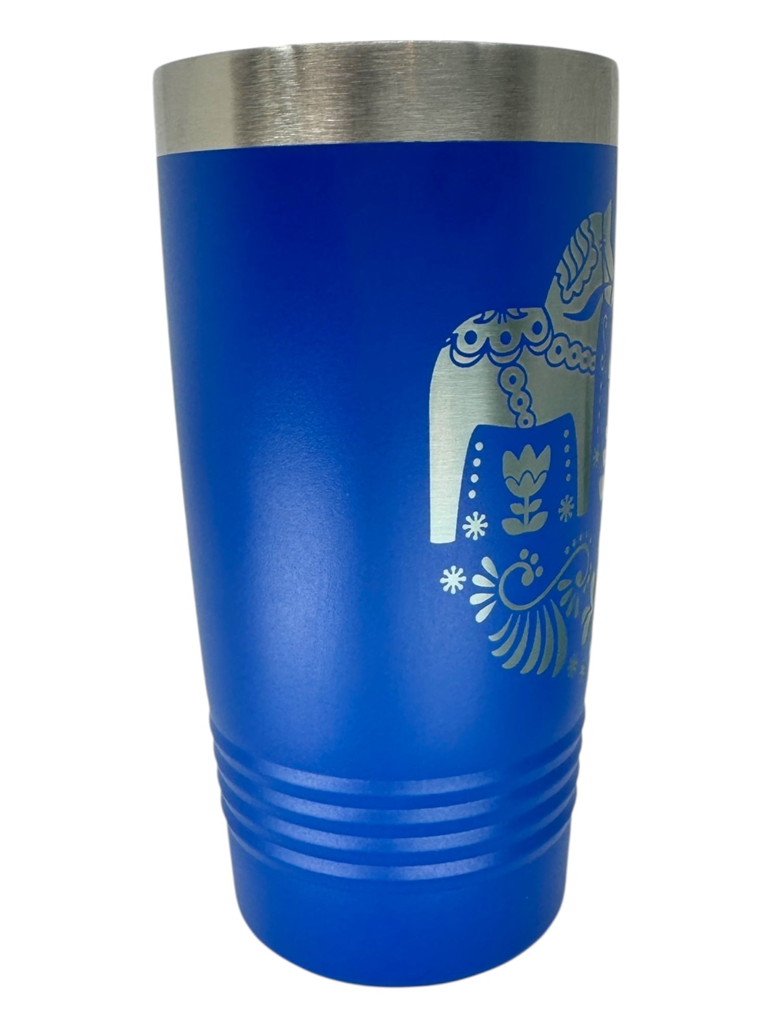 The Tumbler: Swedish Dala Horses - Blue 20oz Stainless Steel Tumbler w/ Slide-Close Lid features a metallic rim and silver Nordic-inspired design reminiscent of Swedish Dala Horse motifs.