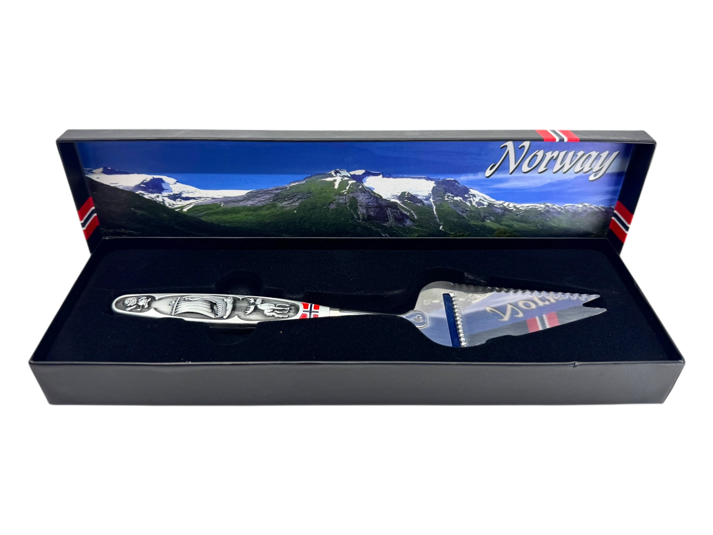 The Jagged Norwegian Cheese Slicer & Cutter features a pewter handle with a Viking ship and moose design, celebrating Scandinavian heritage. Includes decorative gift box.