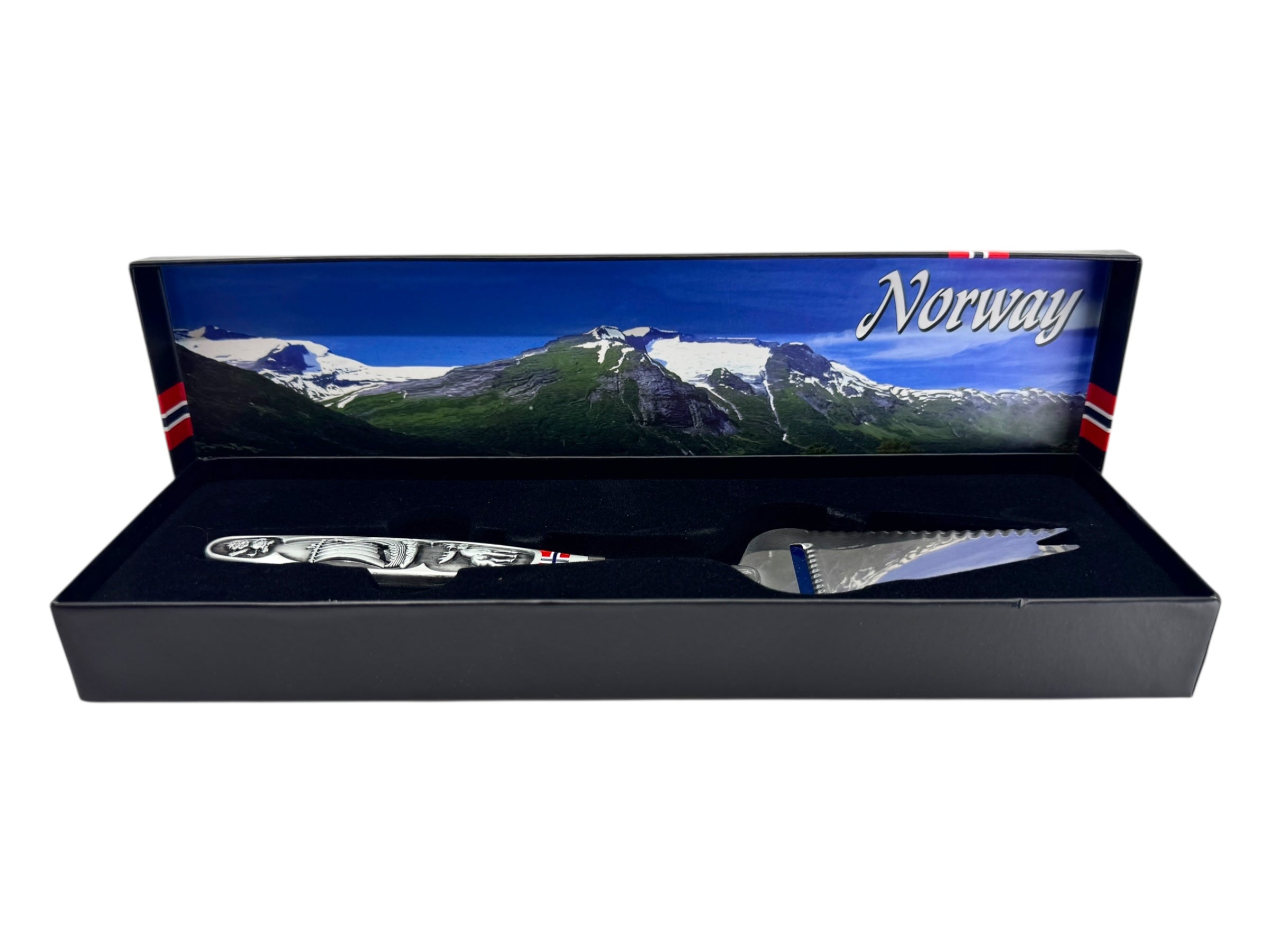 The Jagged Norwegian Cheese Slicer & Cutter features a pewter handle with a Viking ship and moose, and comes boxed—a unique souvenir that celebrates Scandinavian heritage.