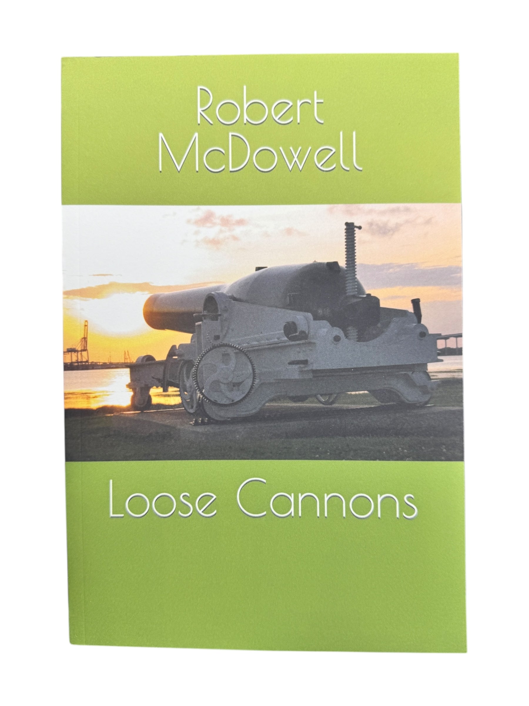 The cover of Book: Loose Cannons by Robert McDowell displays an old cannon set against a sunset and a pier.