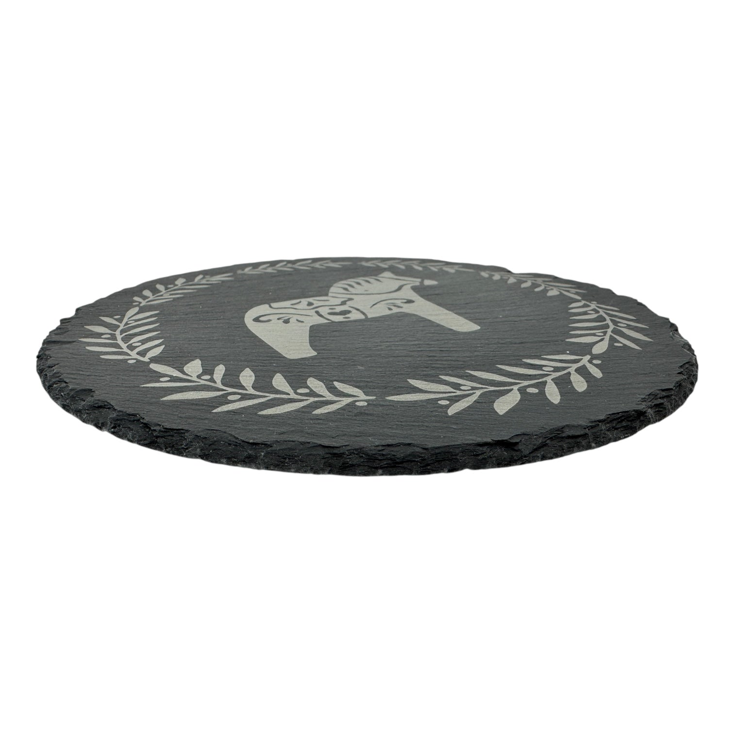 9.75 black slate trivet with rough edges, featuring an etched Swedish Dala Horse surrounded by a laurel wreath—a tribute to Scandinavian design and Swedish tradition.
