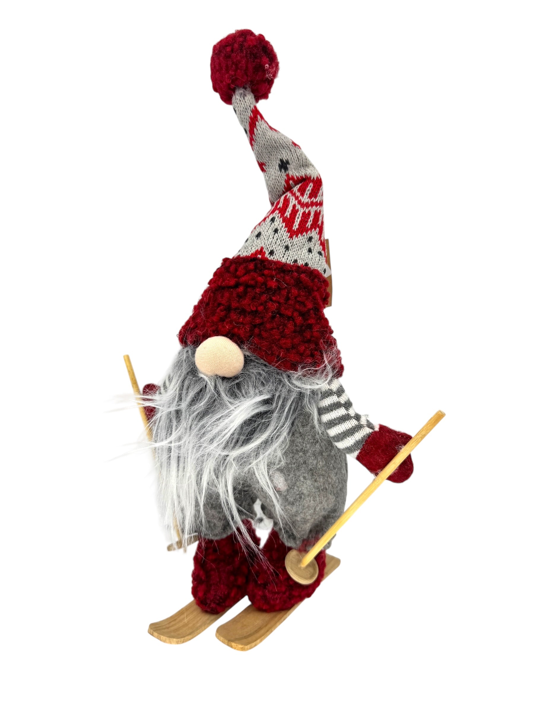 Nene the Gnome is a 15 tall Scandinavian-style figurine with a gray beard, red hat, and scarf, standing on wooden skis with poles—perfect as a whimsical skiing holiday or Christmas table decoration.