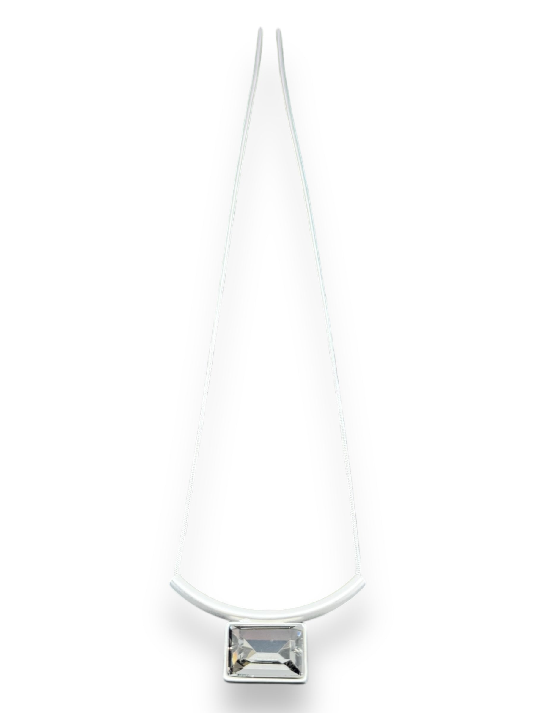 The Audrey Black Diamond Silver Plated Necklace by DANSK Copenhagen features a transparent rectangular pendant that embodies Nordic design, offering a minimalist aesthetic on a white background.