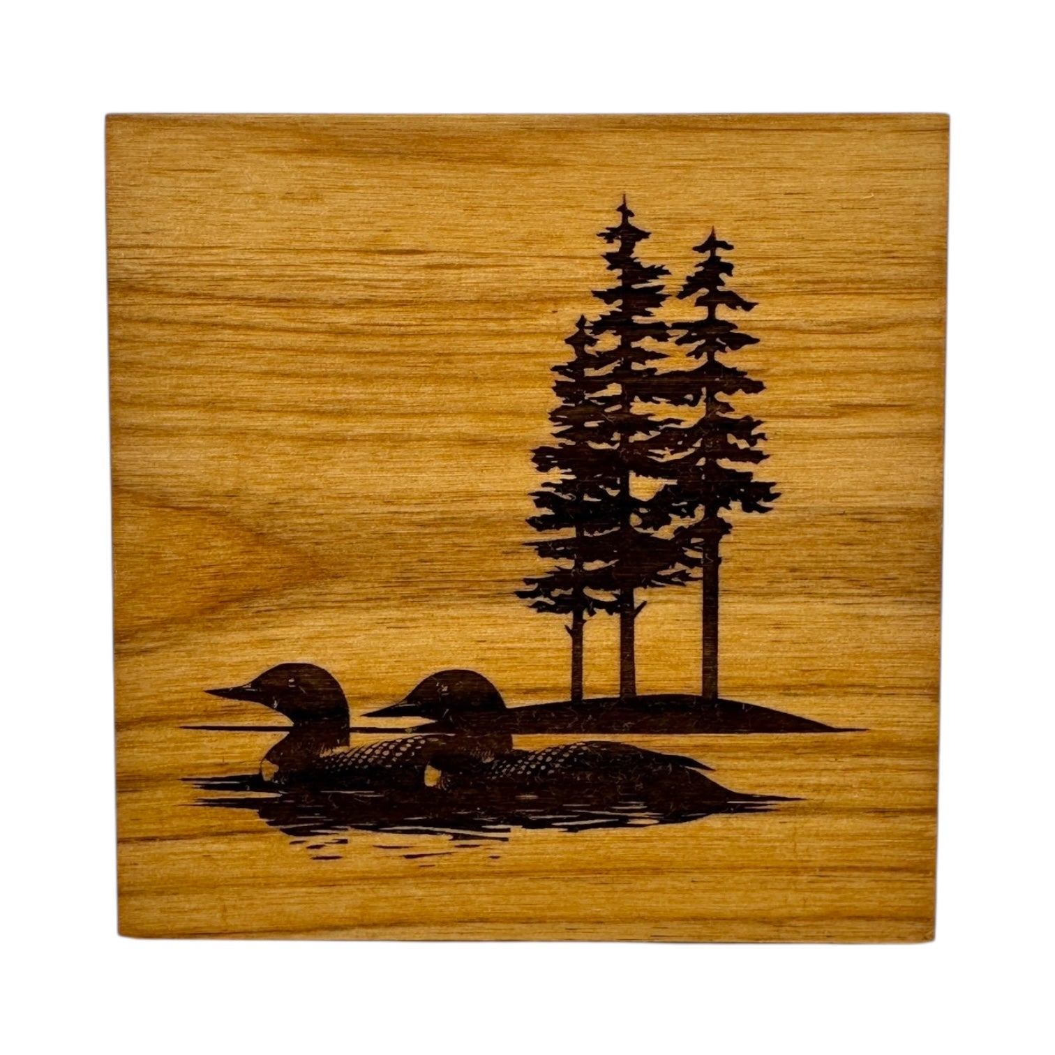 Inspired by nature, the Coaster: Two Loons on the Lake 4x4 Alder Coaster features an engraved design of two loons swimming with three pine trees in the background.
