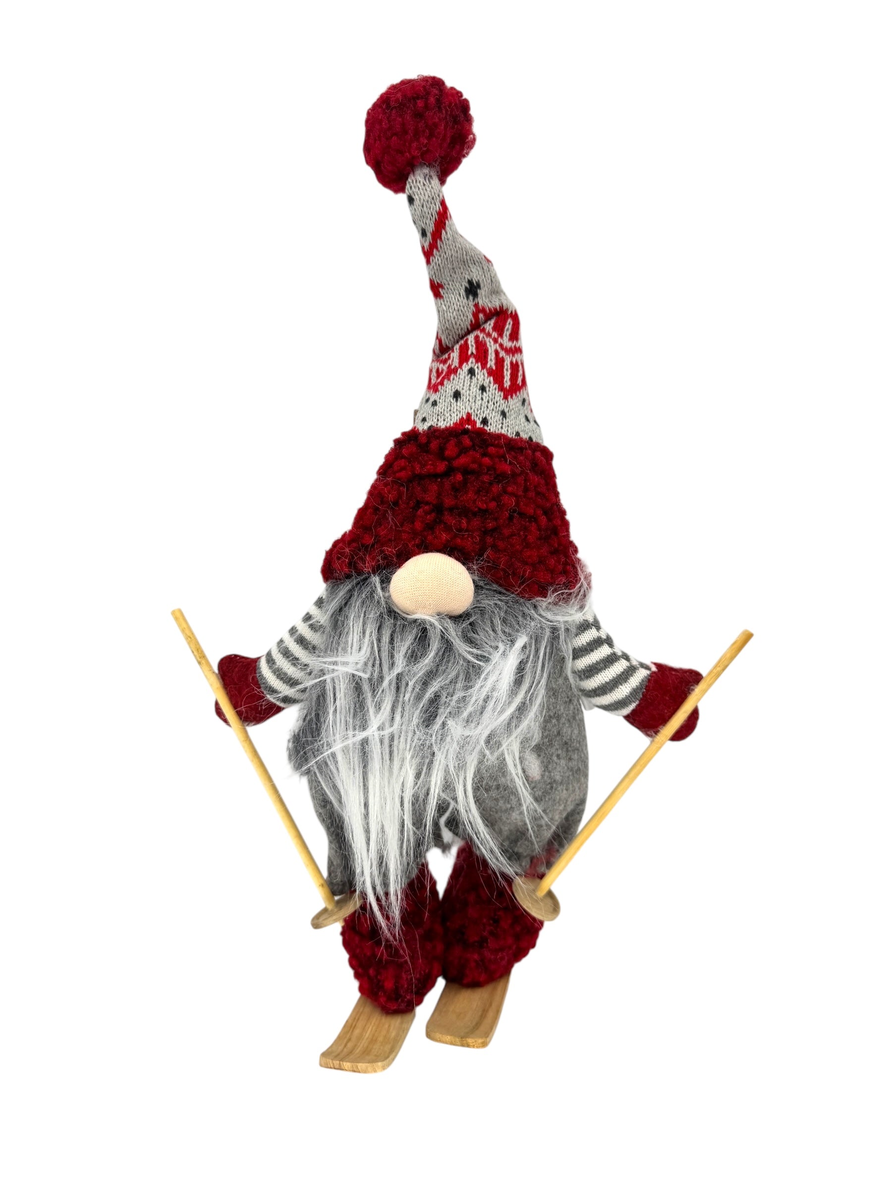 Nene the Gnome – Skiing Holiday Table Decoration (15 tall) features a Scandinavian figurine with a long gray beard, red hat, striped shirt, mittens, skis, and wooden poles—perfect for Christmas or holiday table decor. Isolated on white.