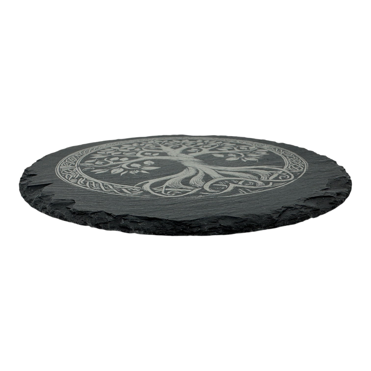 The 9.75 slate trivet features a carved Tree of Life design inspired by Norse mythology, showcased on round black slate.